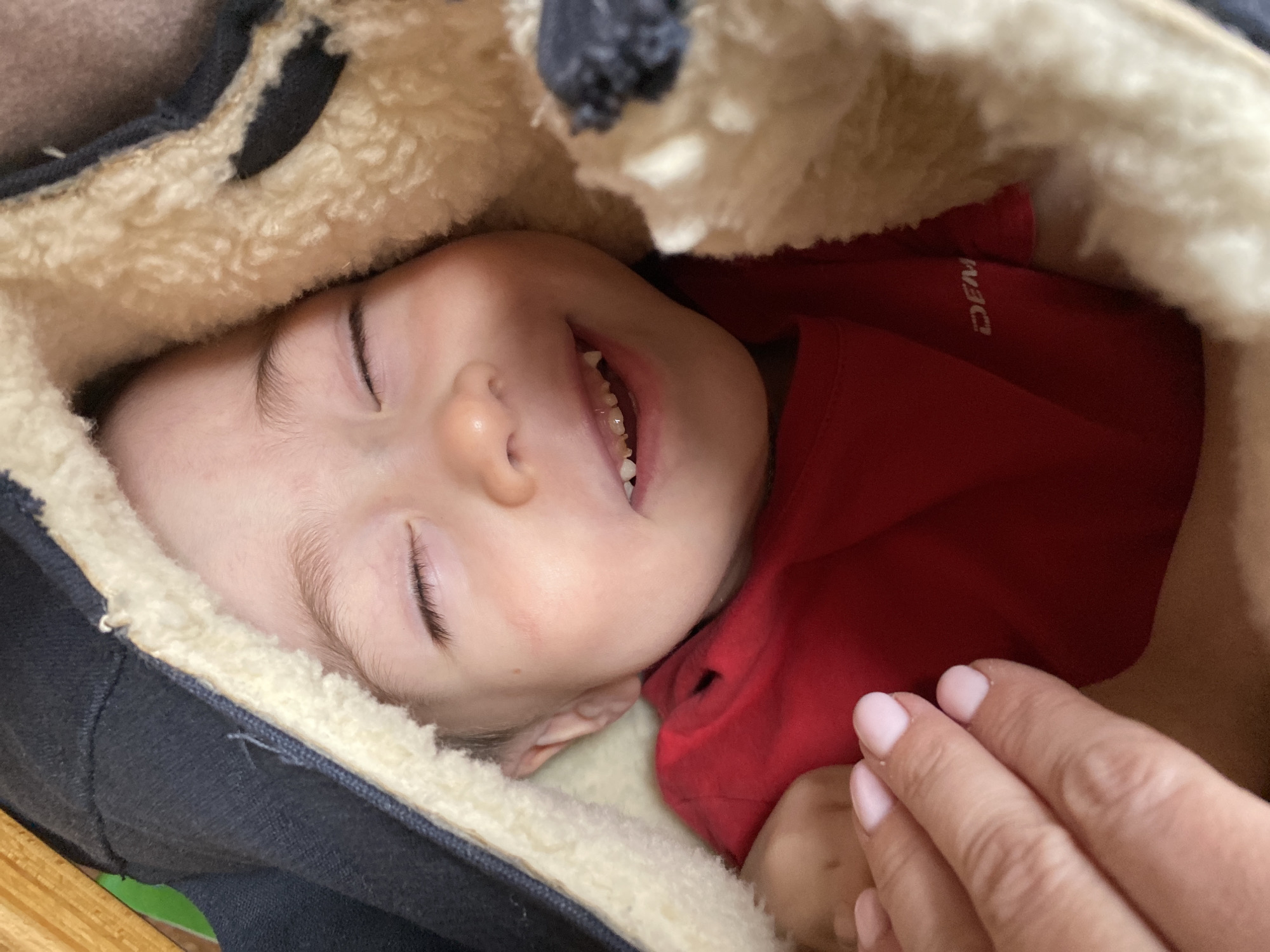 Baby photographed sleeping in carrier in Ольховка, Russia