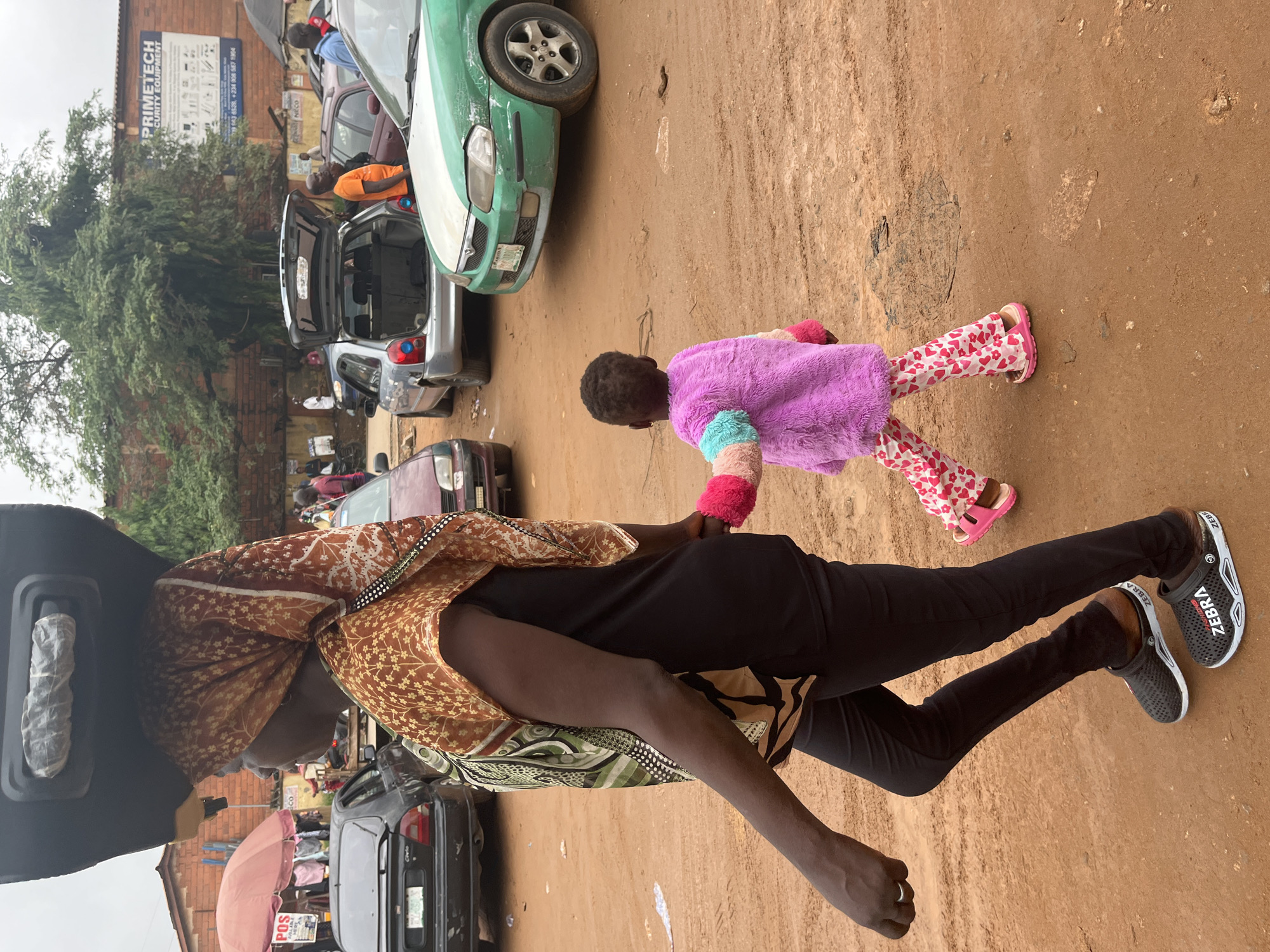 Daily life documented at busy Abuja marketplace during morning hours