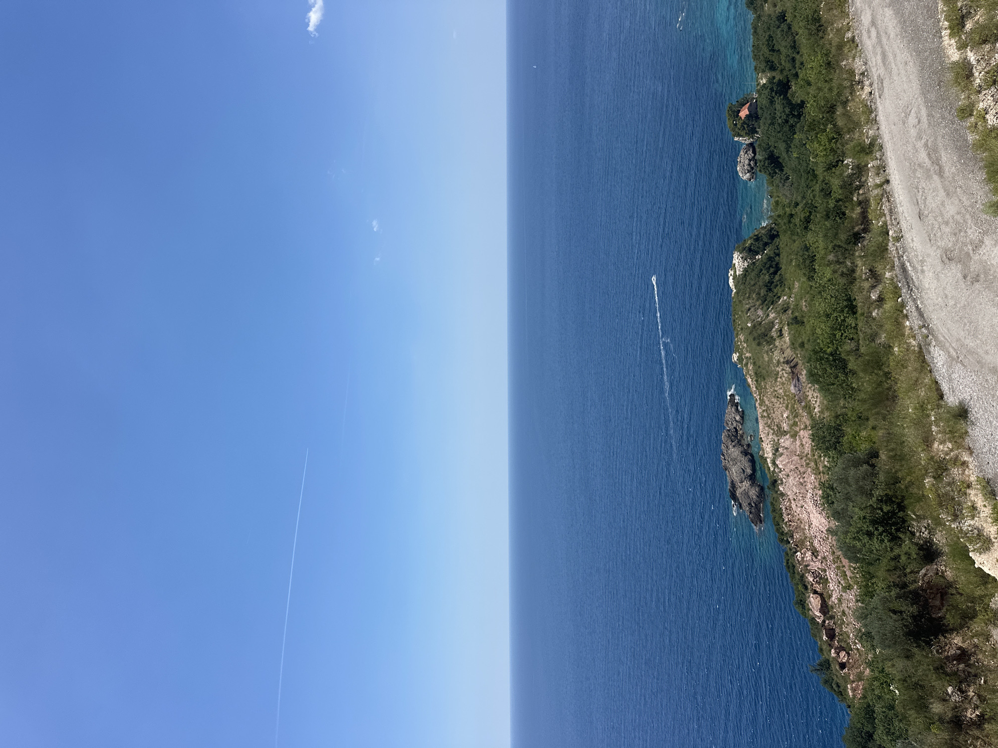 Summer day at Mirište beach, Montenegro — paddleboarding, sunbathing, coastal views