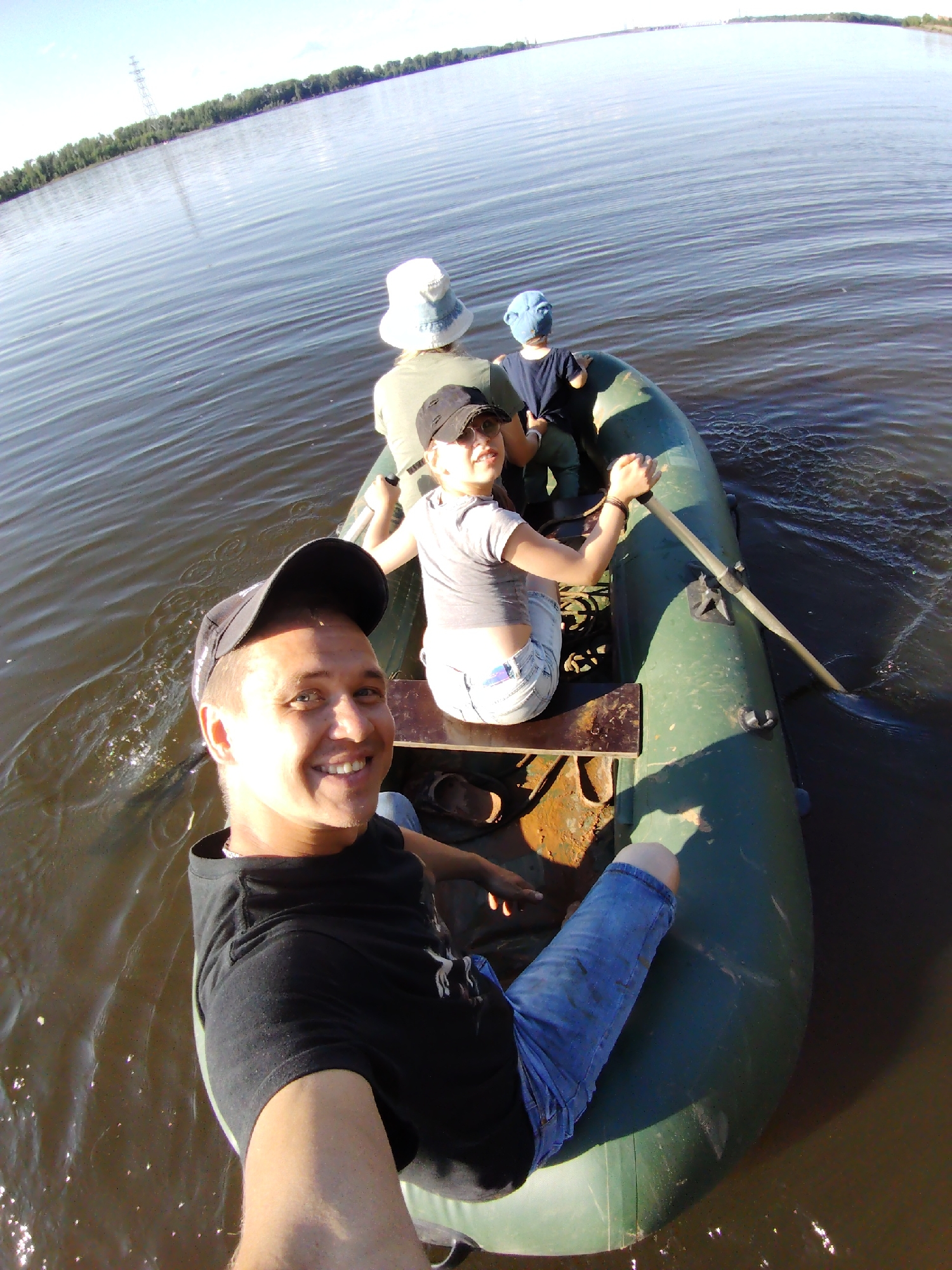Afternoon river float in a green inflatable boat, Прикамский