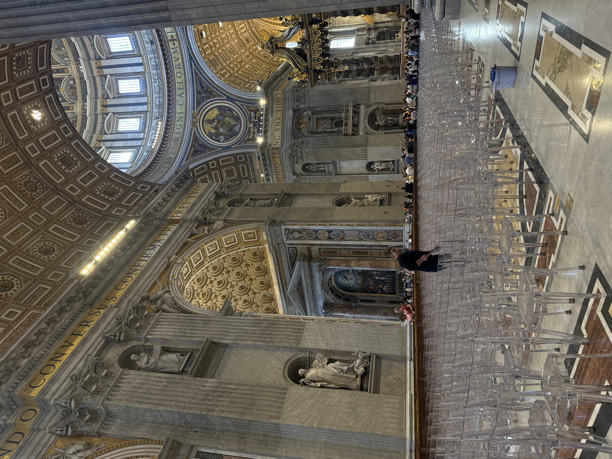 Visitors in green gather at St. Peter's Basilica