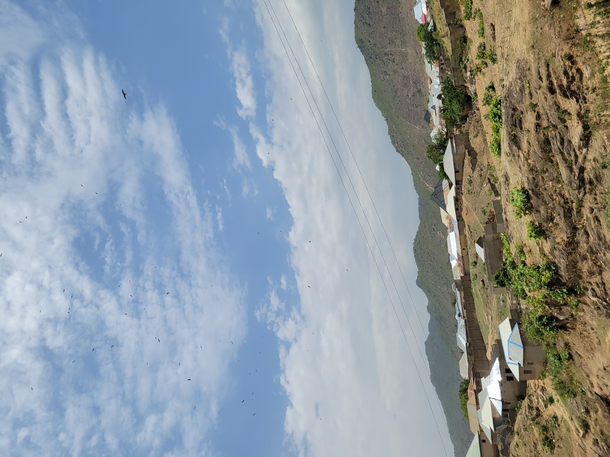 Hillside village with colorful roofs documented in Tilde, Nigeria