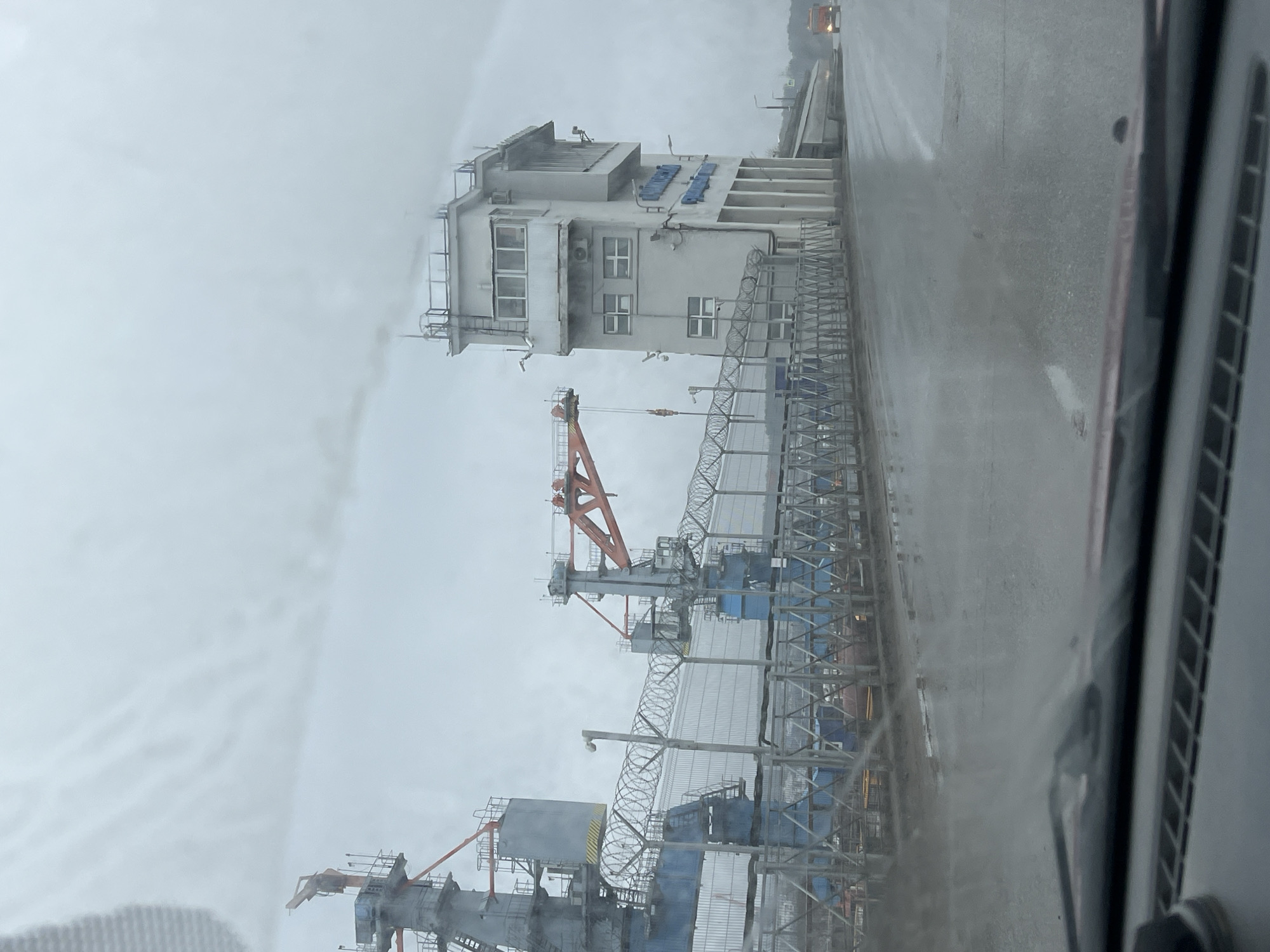 Overcast industrial view captured from vehicle in Chaikovsky, Russia