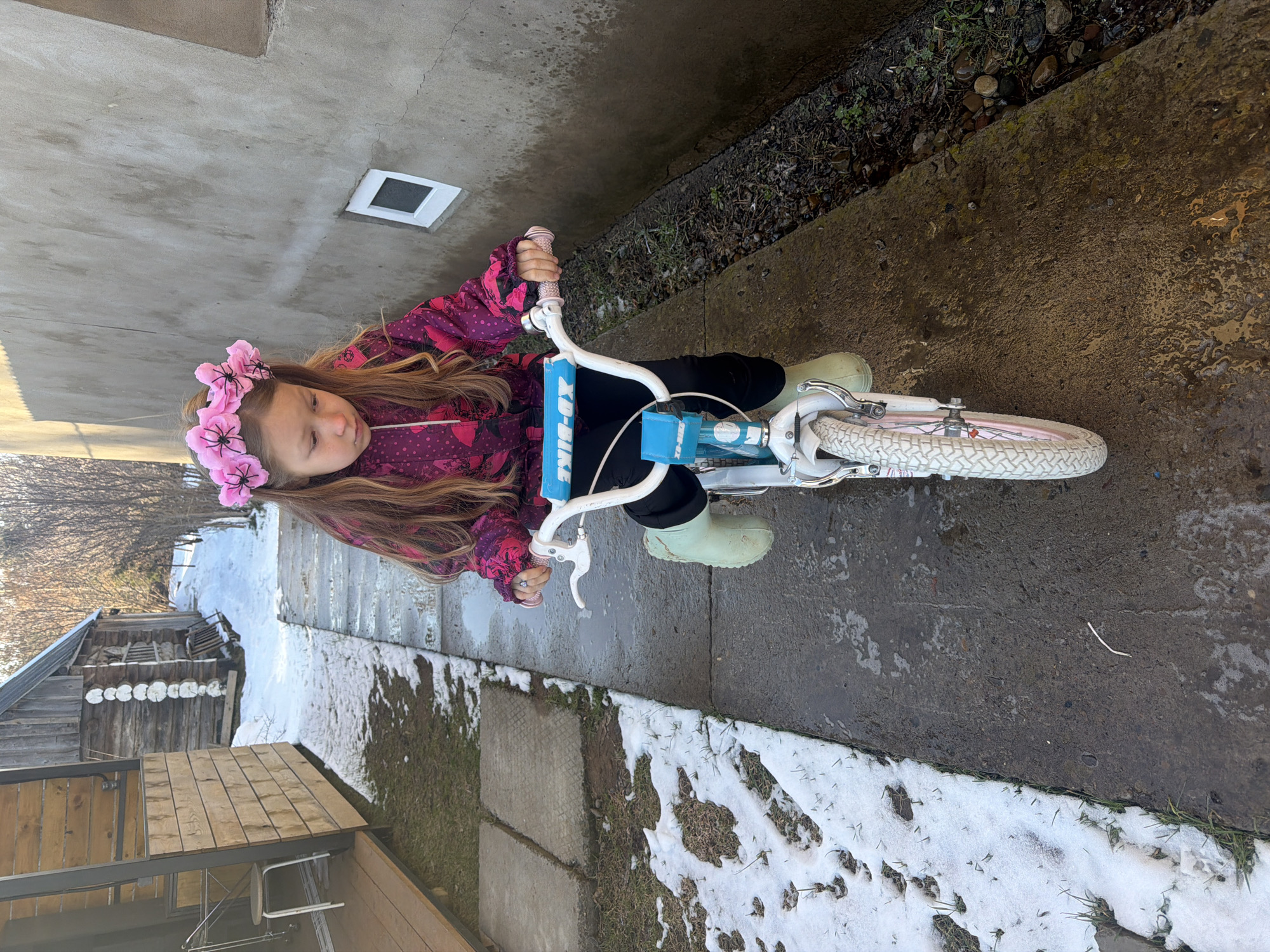 Young girl observed in casual outdoor and indoor settings
