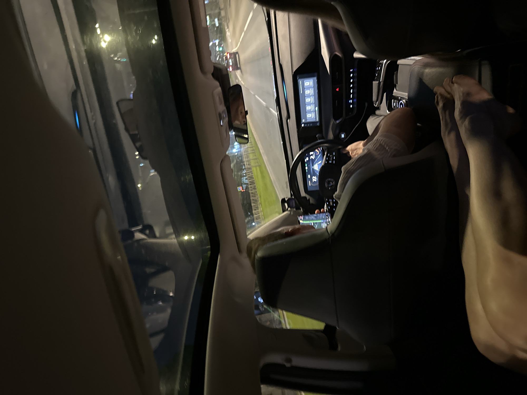 Driver uses navigation app while driving at night in Saint Petersburg