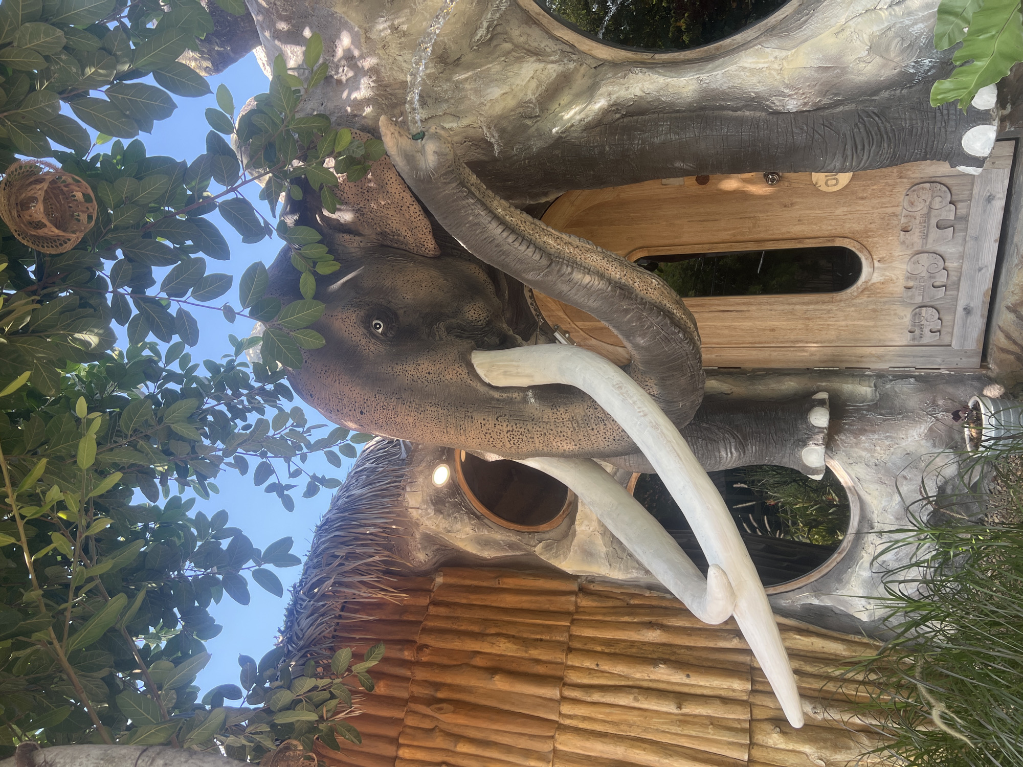 Elephant-shaped thatched building with tusks and trunk archway, Ko Samui