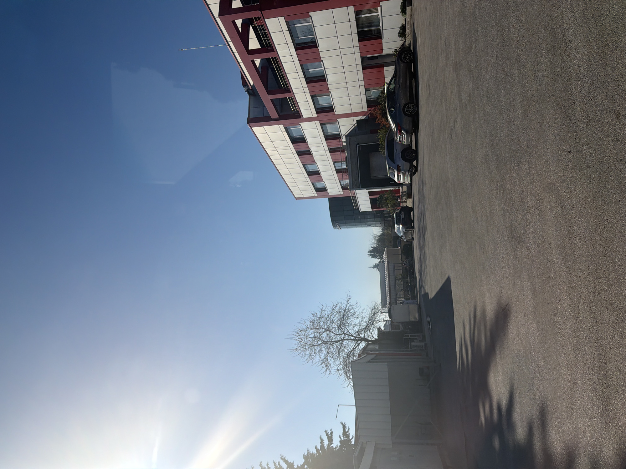 Modern red-white building with metal structure observed in Plovdiv