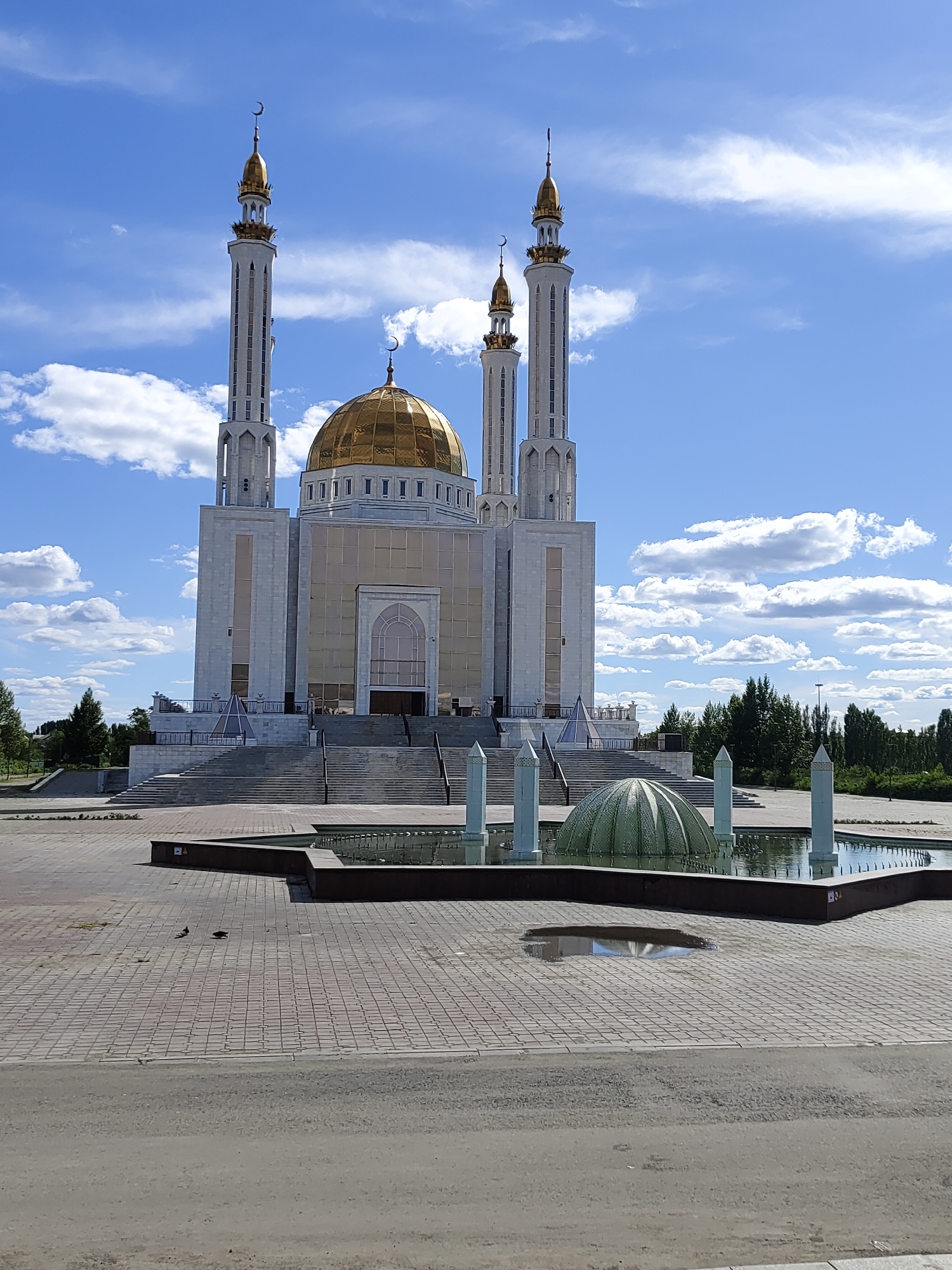 Summer morning in Aktobe: mosques, snacks, and city streets