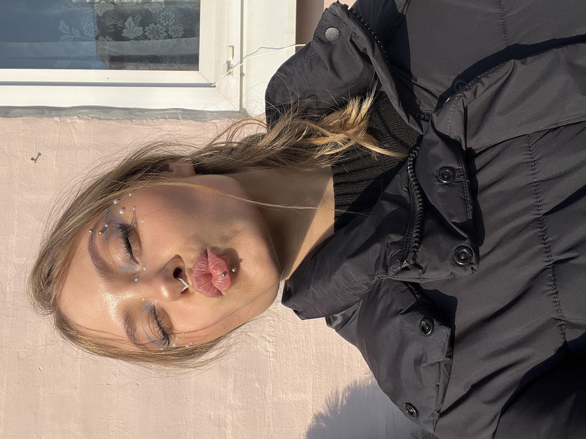 Women pose for photos in sunny Фоки, Russia