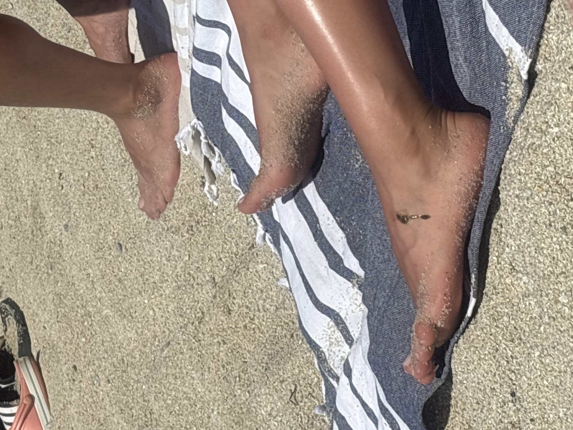 Sunny afternoon on Tropea's beach below the clifftop church