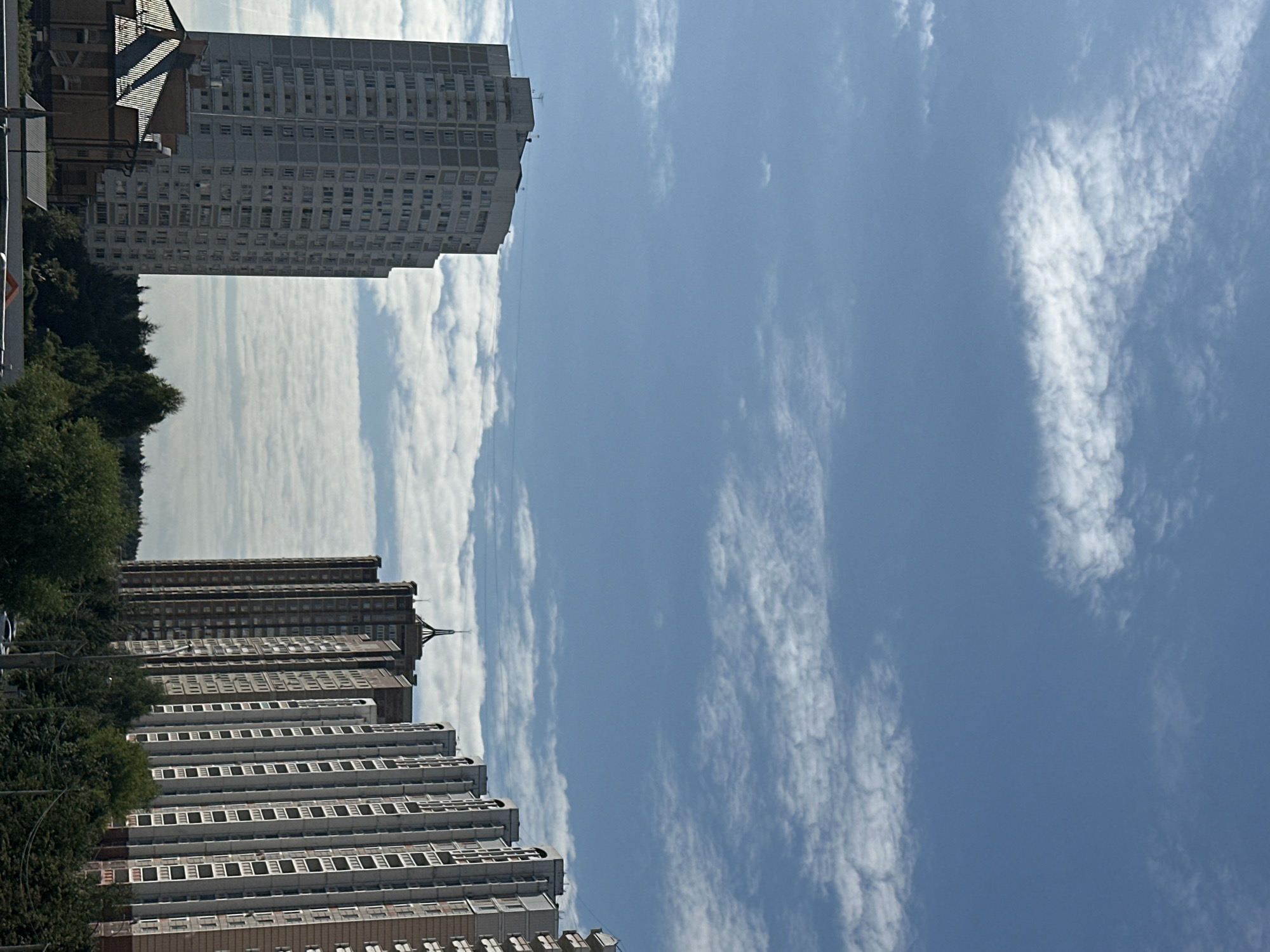 Podolsk apartment blocks under a bright summer morning sky