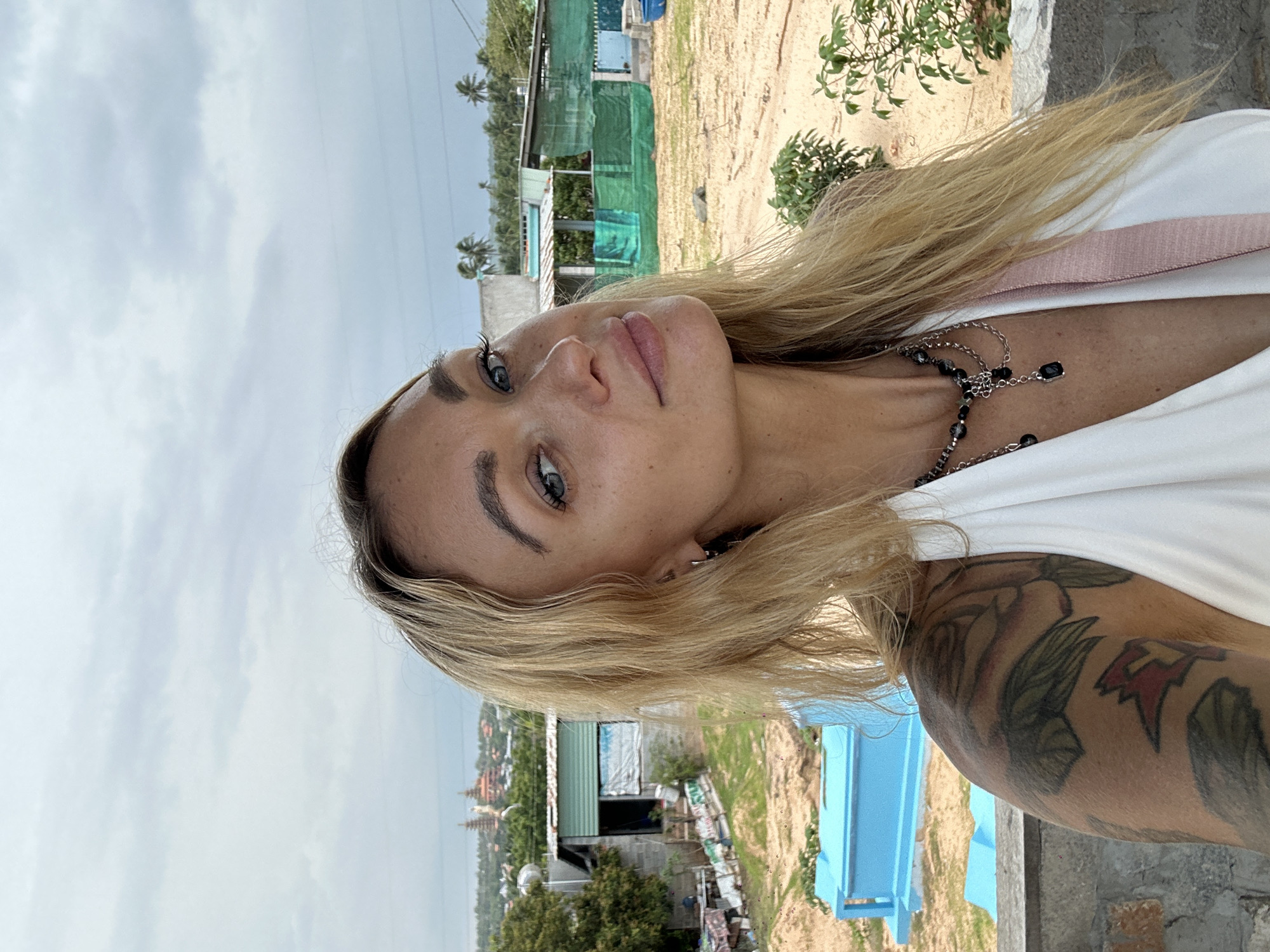 Tourist photographs herself at Mui Ne resort location