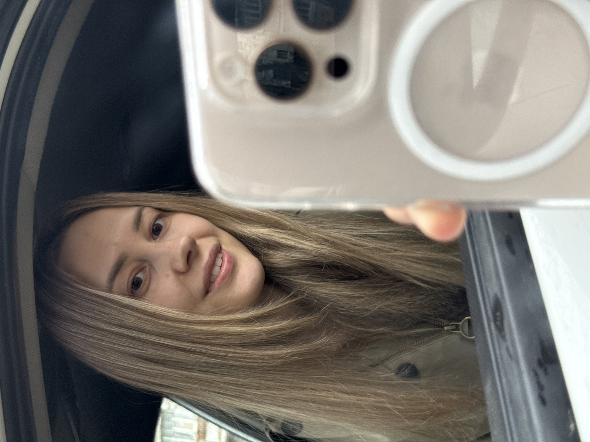 Woman photographs herself near Russian Railways train in Chaikovsky