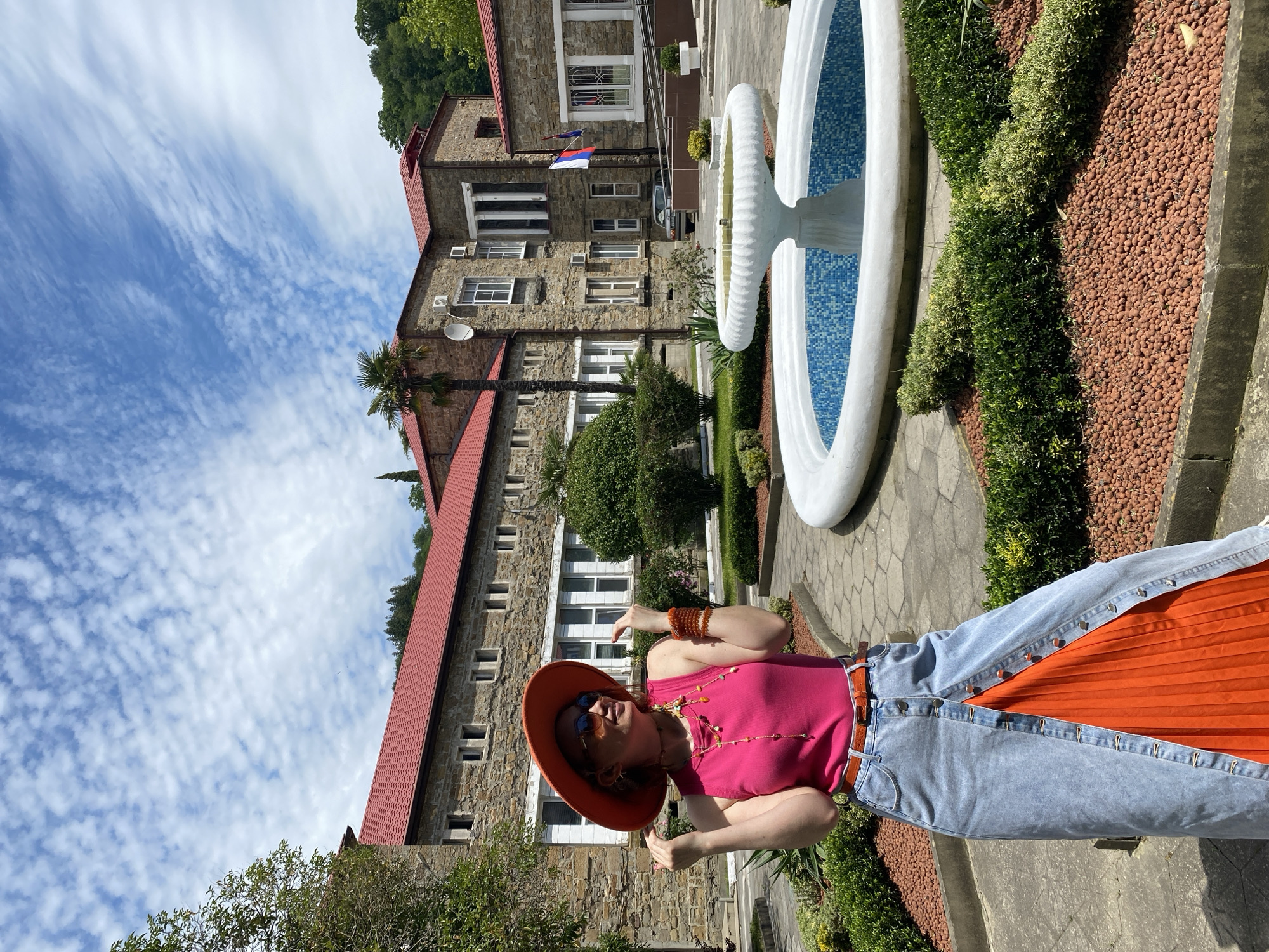 Tourist in pink and orange explores Sochi landmarks