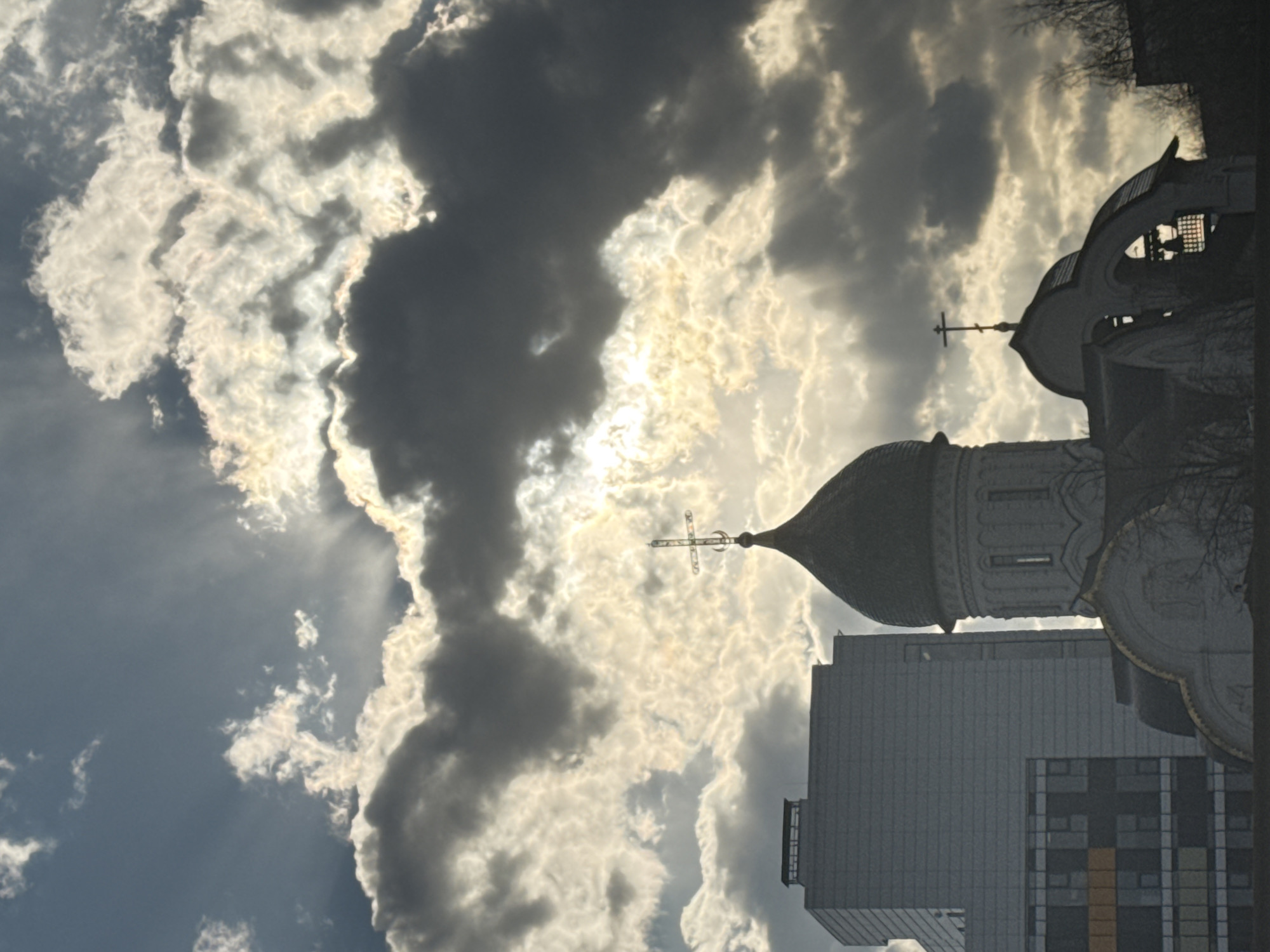 Orthodox church photographed against dramatic Moscow sky