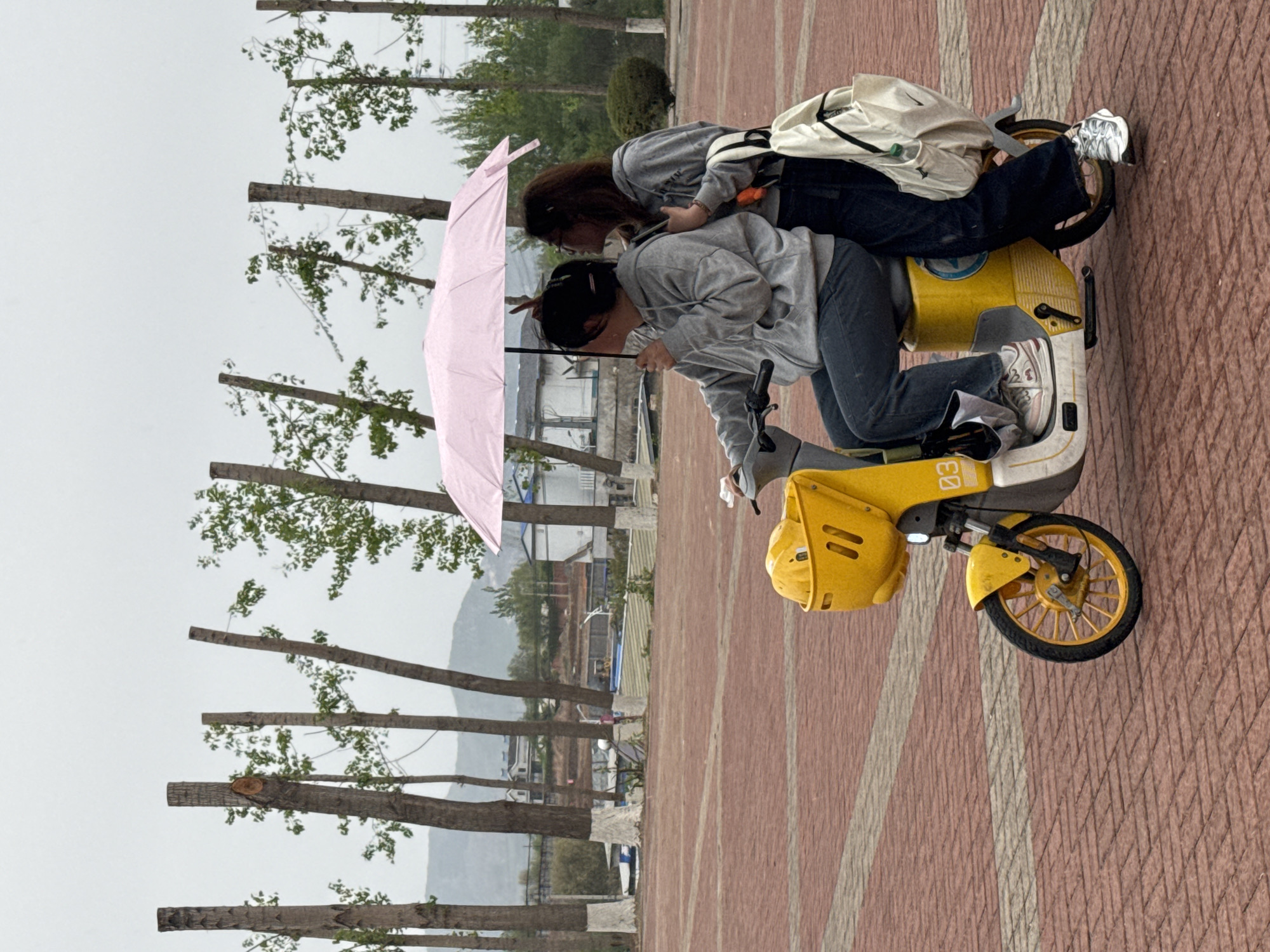 Early morning scooter rides and umbrella walks in Zhongtun
