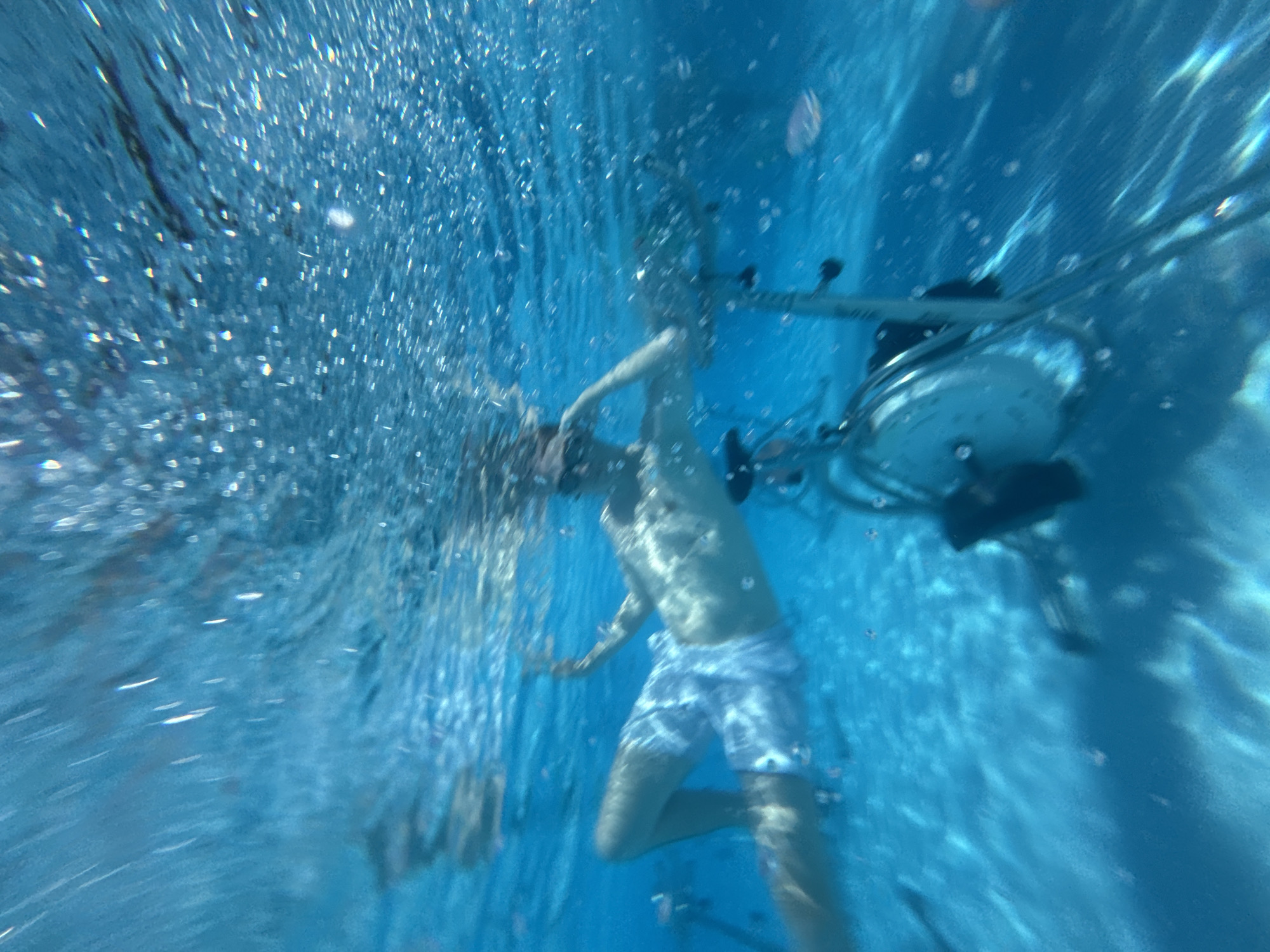 Underwater stationary bikes in use at a Manavgat pool
