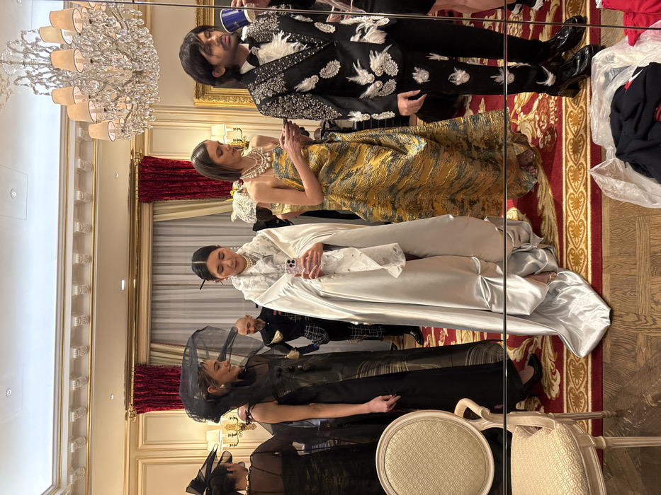 Formal fashion event preparations captured at luxury Parisian venue