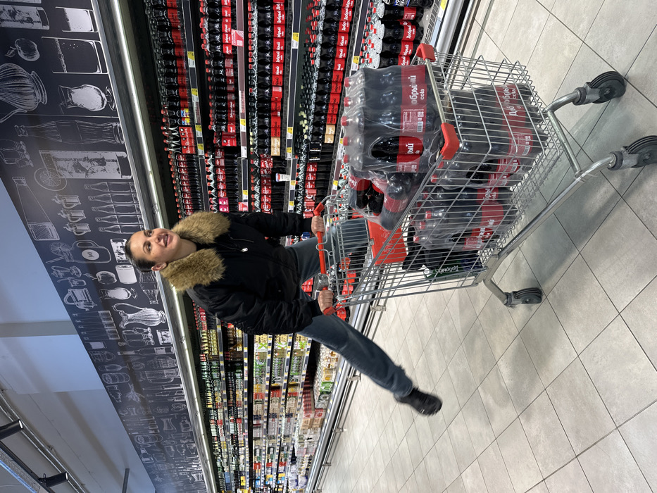 Shoppers browse supermarket aisles in Sochi during afternoon outing