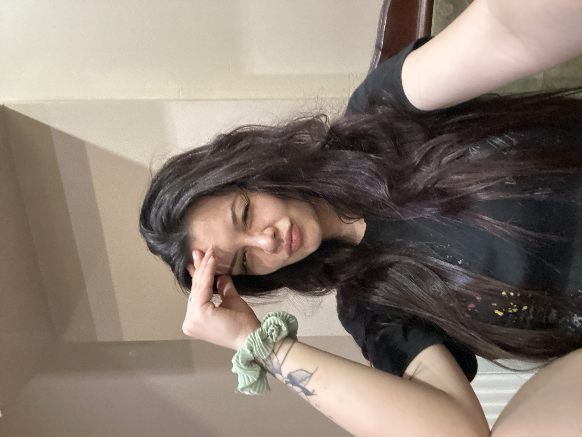 Woman photographs herself with white dog in Sliven home