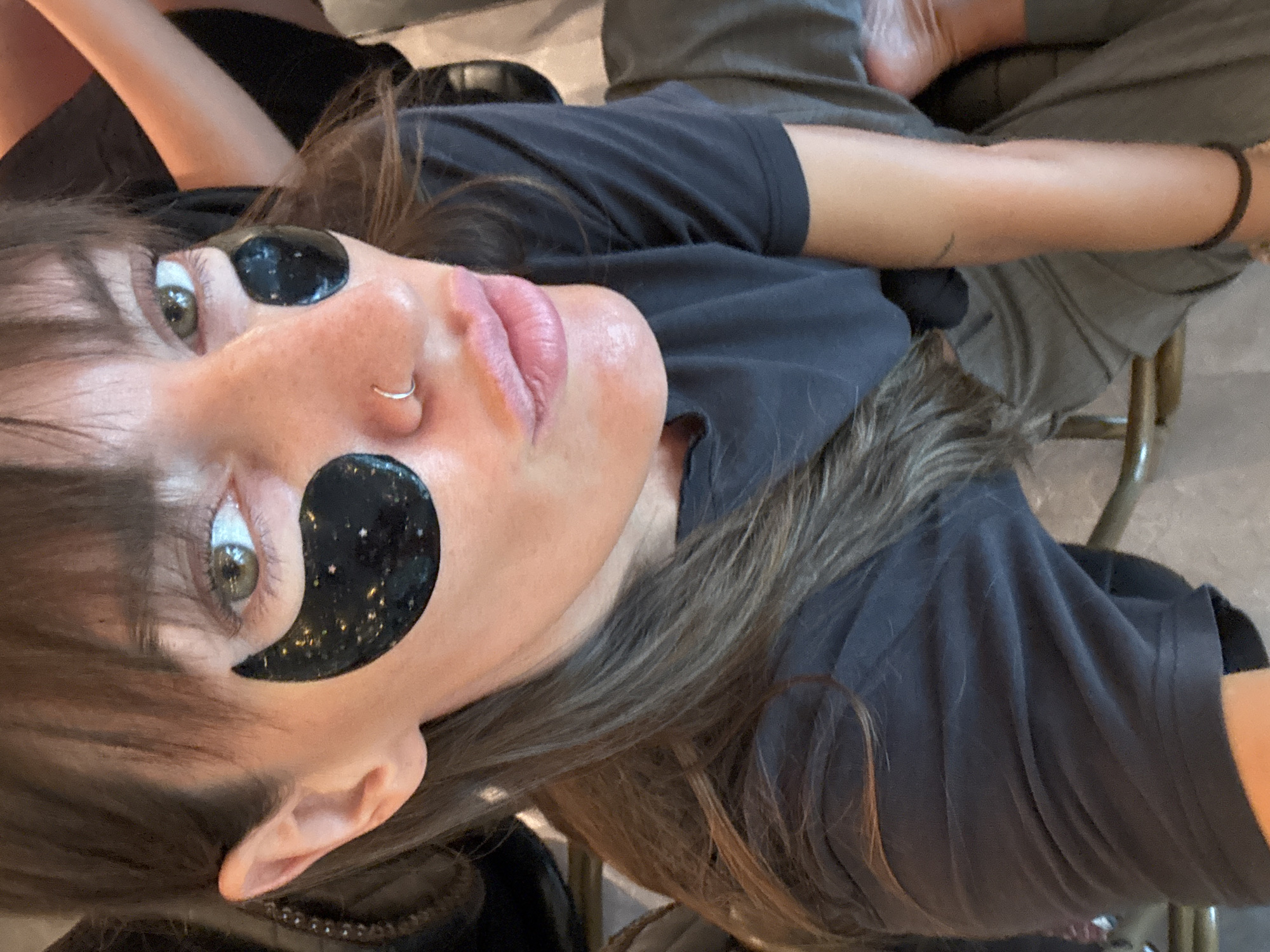 Cafe selfies and elevator mirrors in Singapore, under-eye patches on.