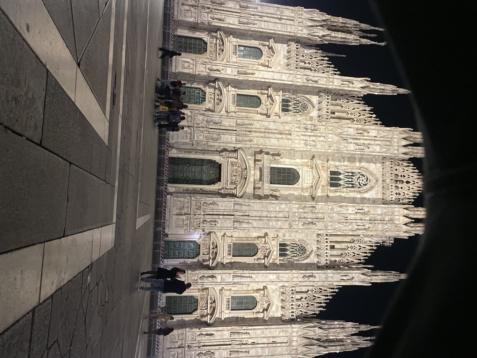 Nighttime gathering at Milan's Duomo cathedral captured by witness