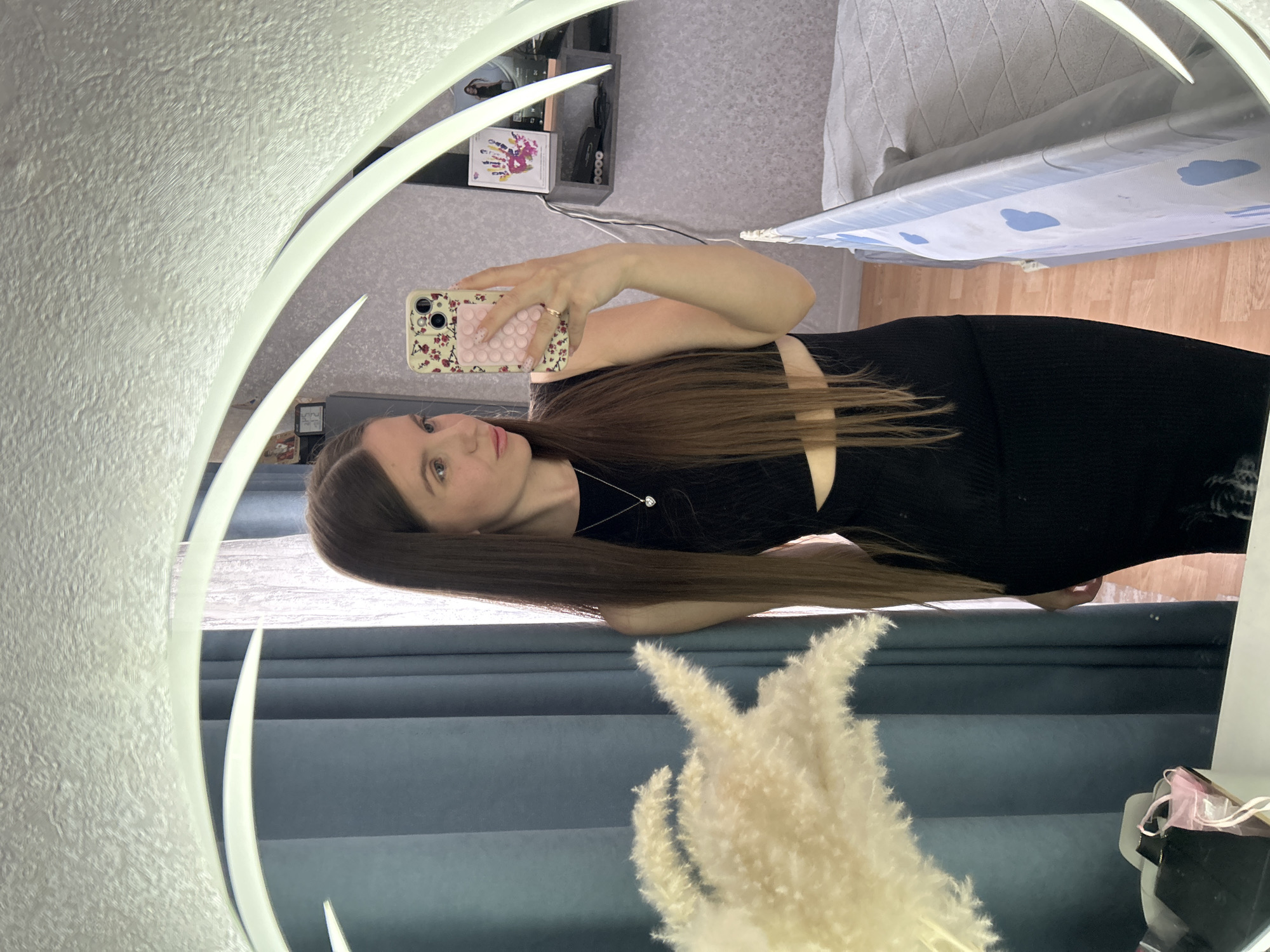 Woman photographs herself in black outfit, Klin Russia