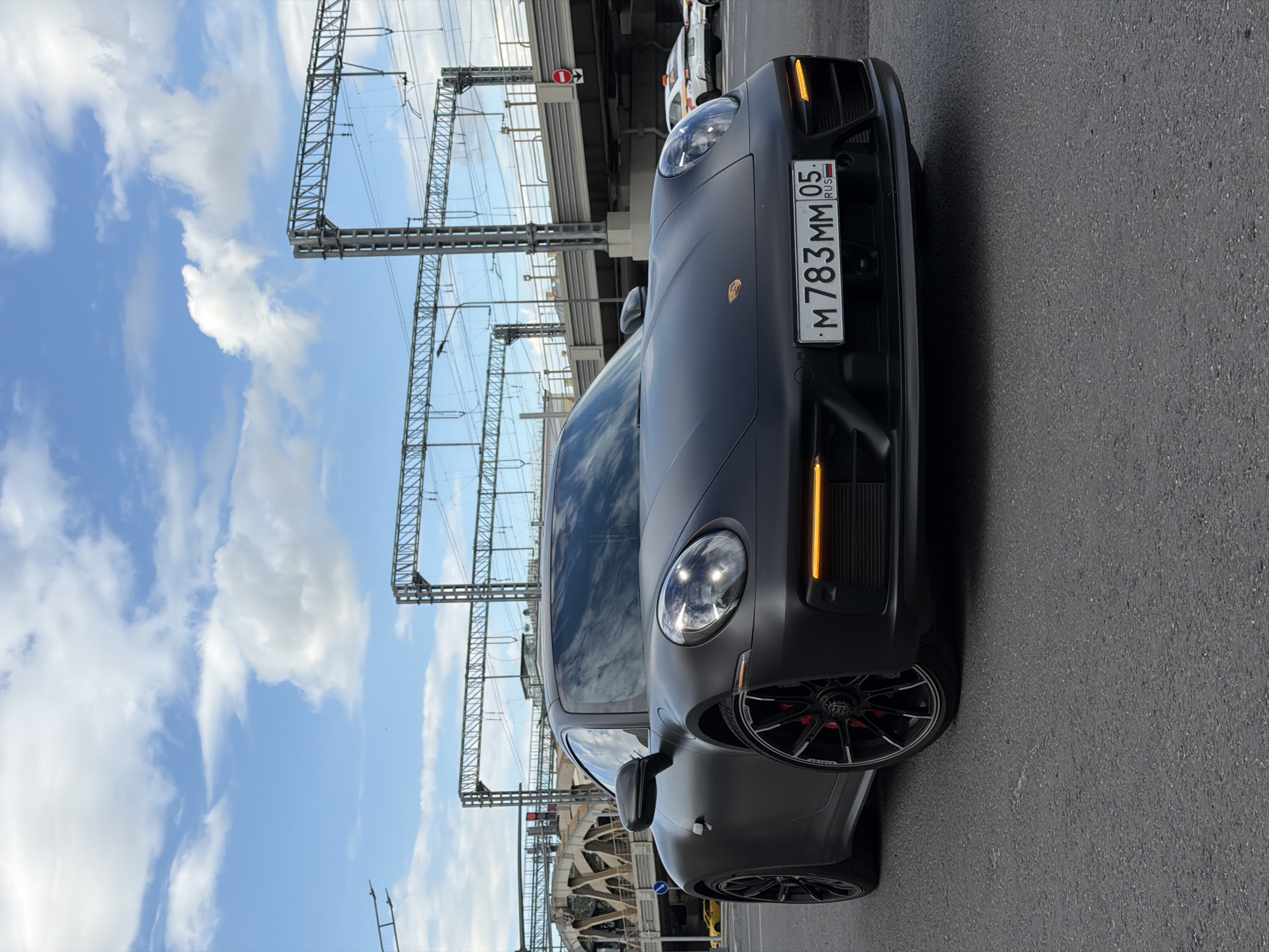 Luxury sedan spotted parked under Moscow bridge structure