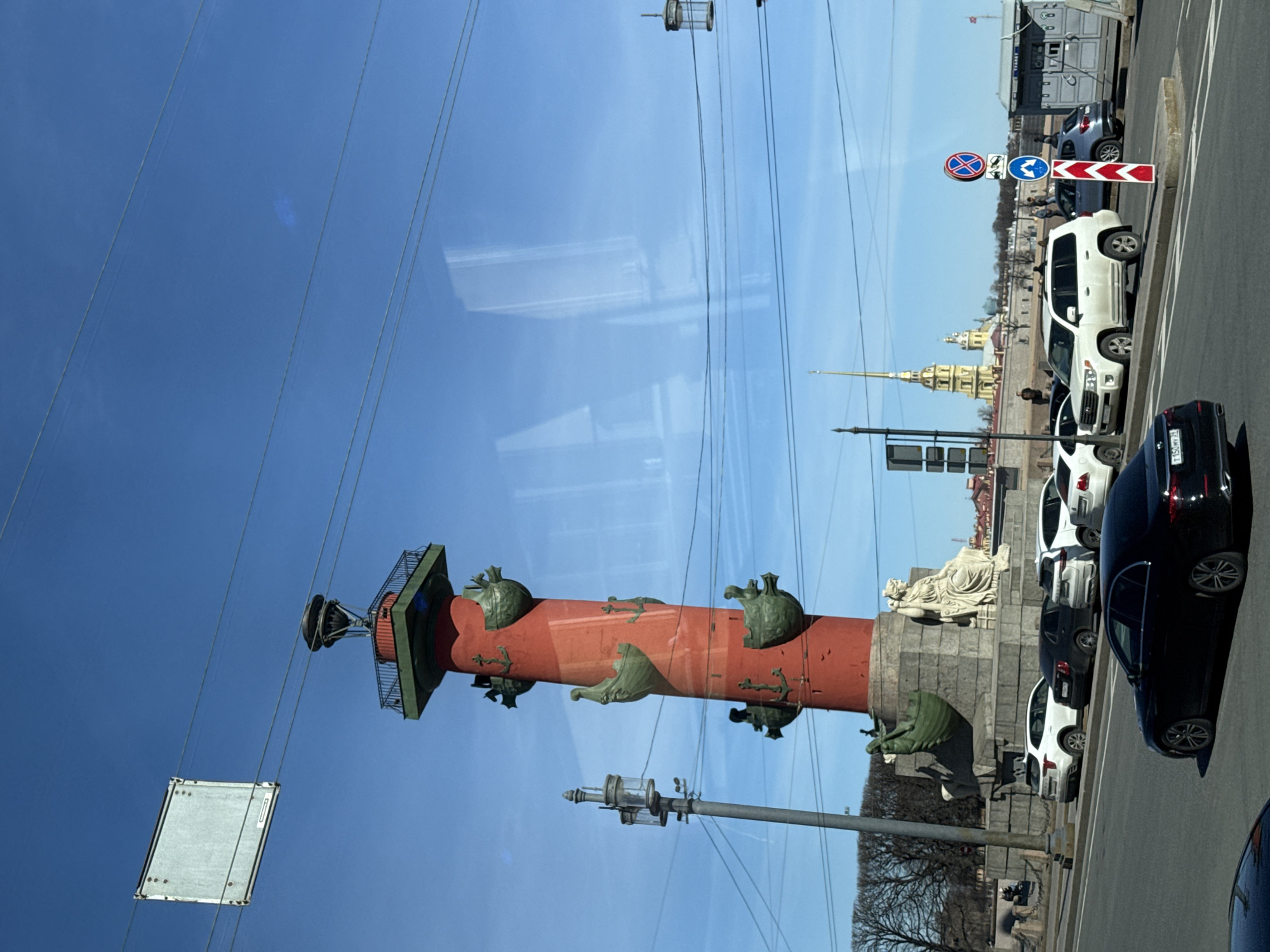 Rostral Column photographed from vehicle in Saint Petersburg