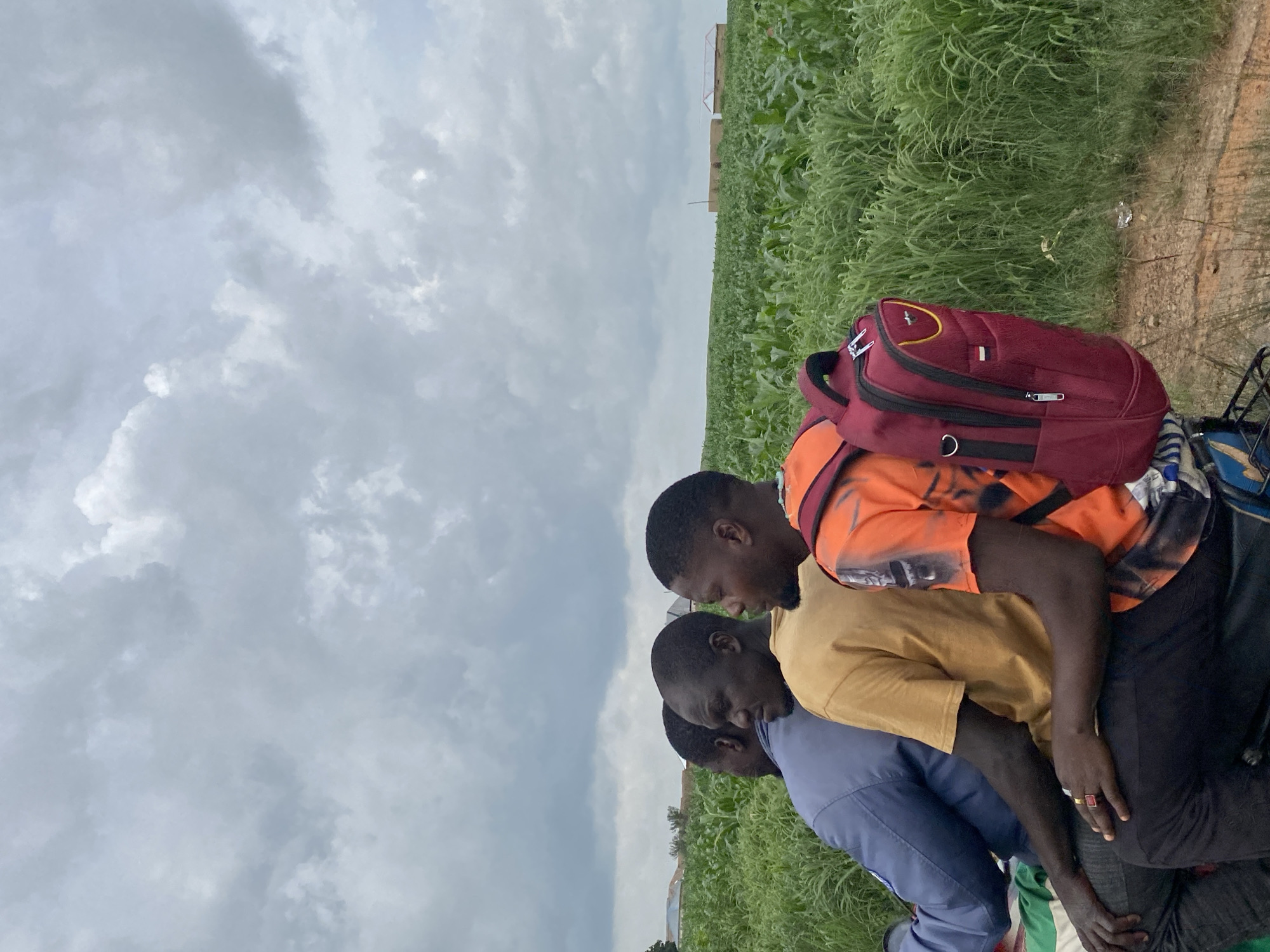Roadside scenes from Kuru, Nigeria: crops, containers, and construction