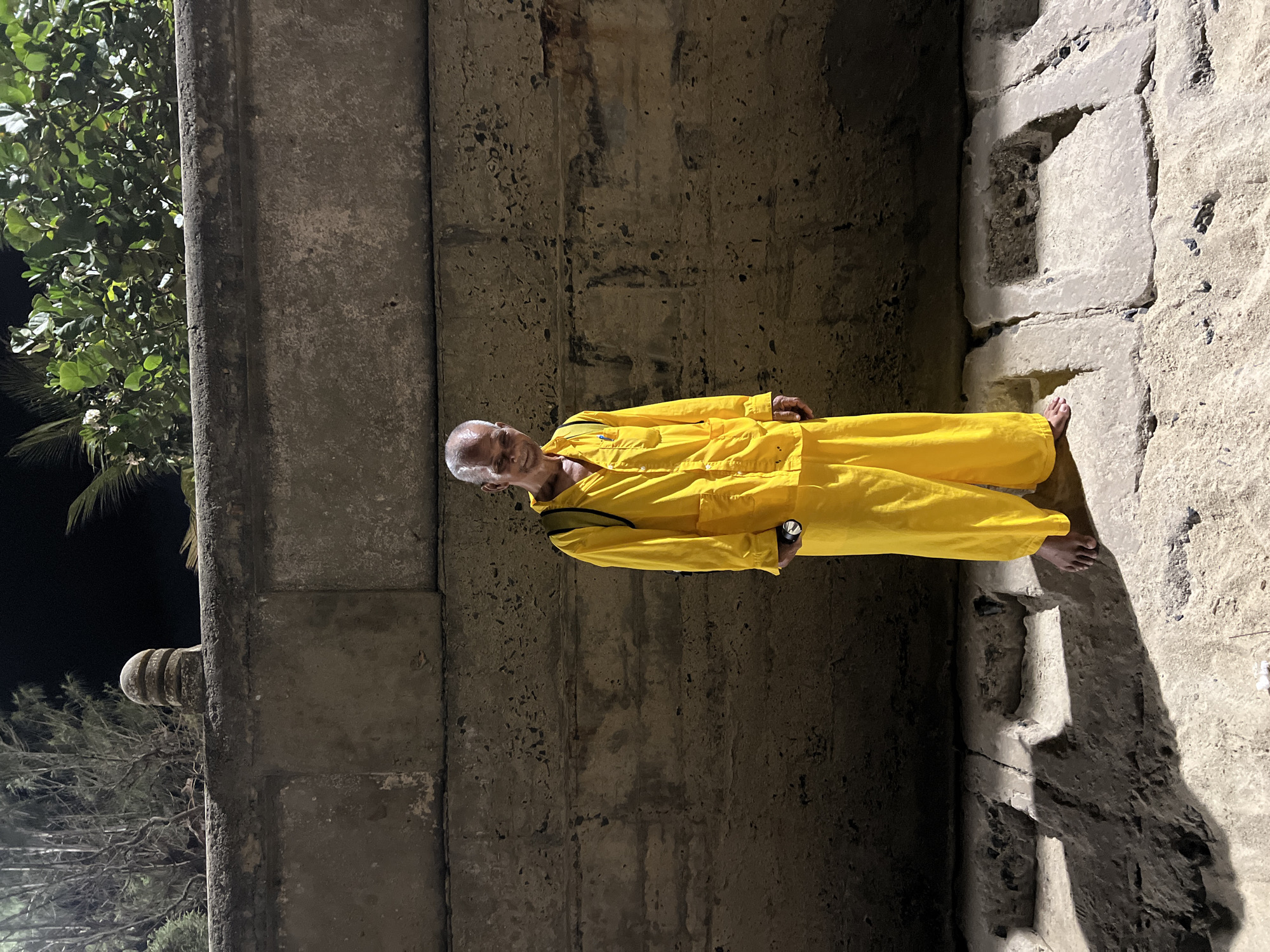 Elderly man in yellow jumpsuit photographed in Nha Trang