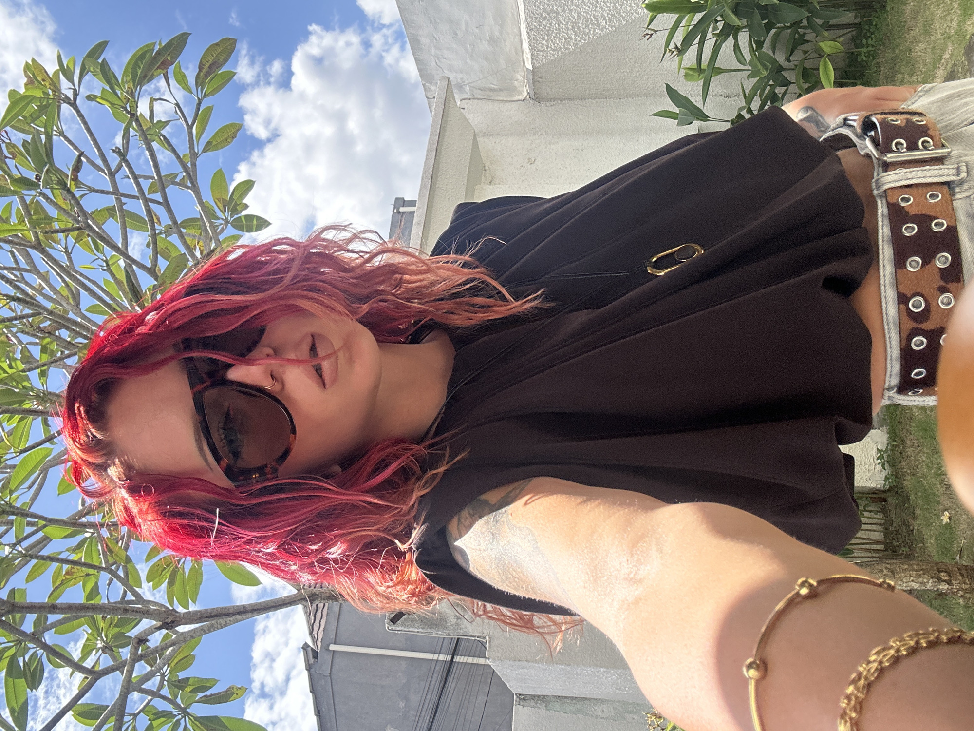 Woman takes selfies in North Kuta, Indonesia early morning