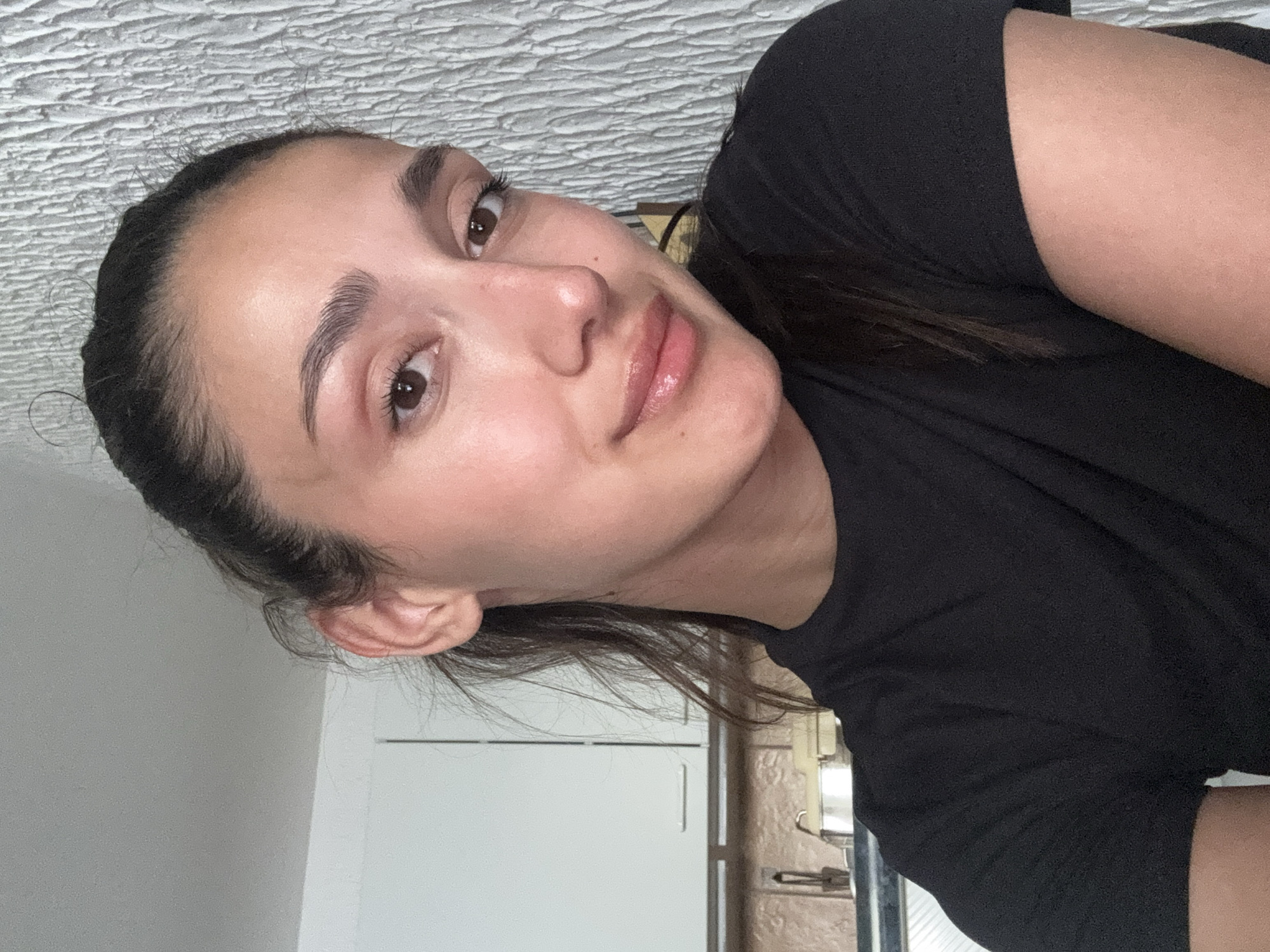 Woman photographed in kitchen setting in Miljevci, Montenegro