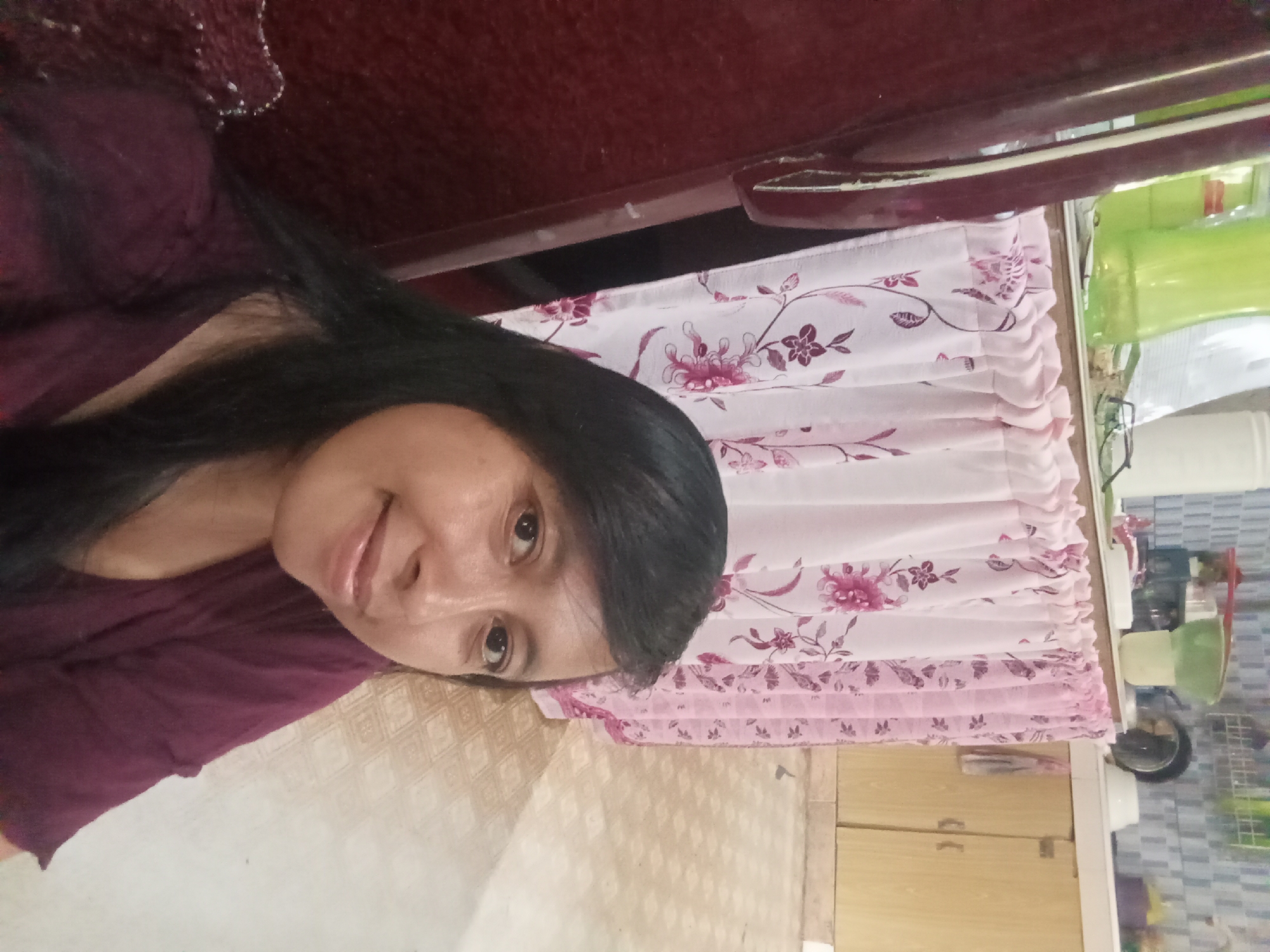 Woman takes multiple selfies in Baron Indonesia kitchen