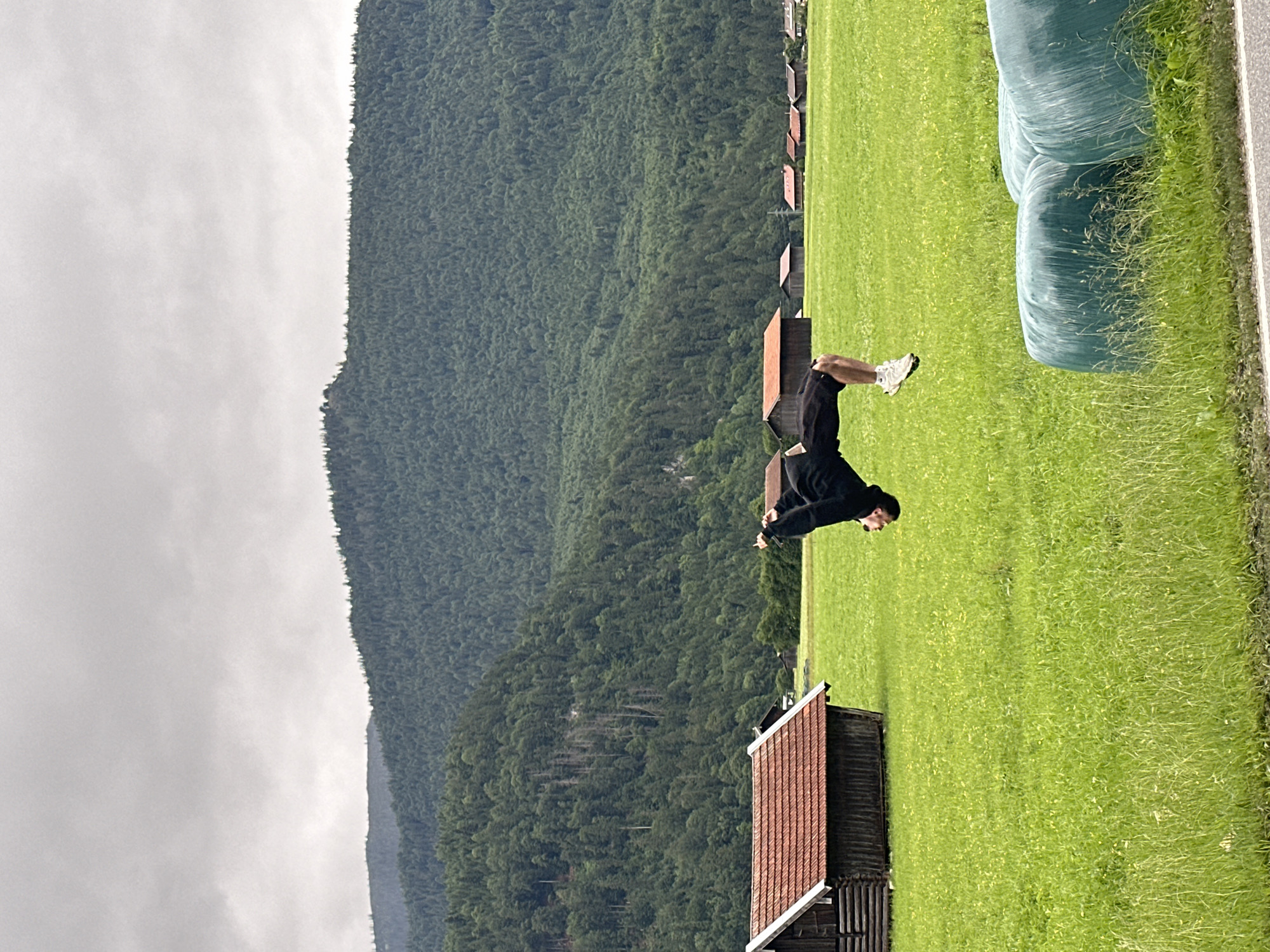 Person performs backflips in Bavarian countryside near Garmisch-Partenkirchen