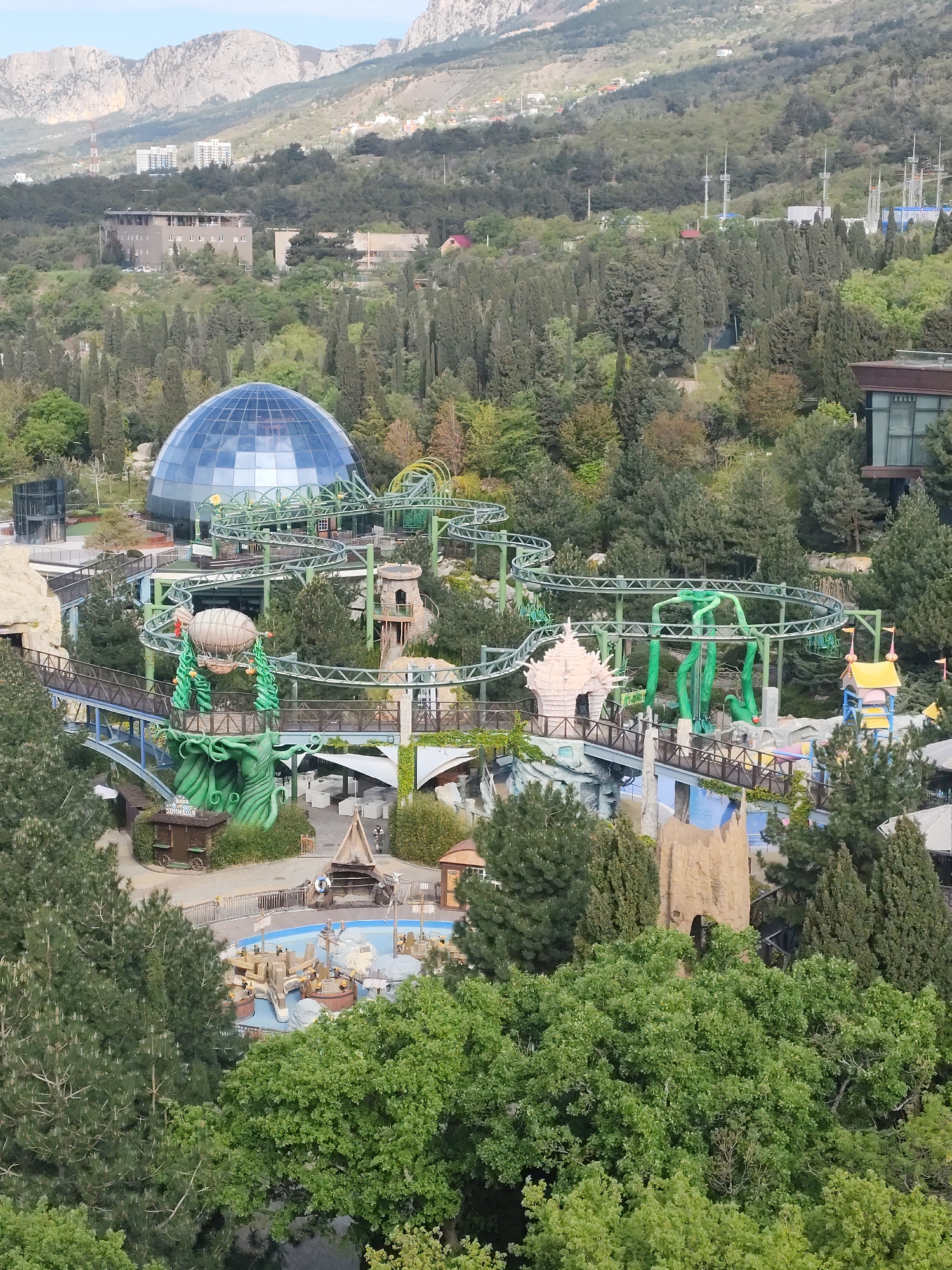 Aerial views document amusement park in mountainous Ukrainian settlement