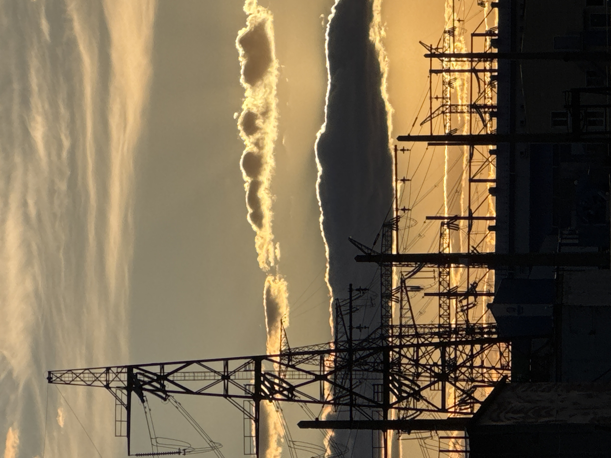 Power lines silhouetted against dramatic sky in Volzhsky, Russia