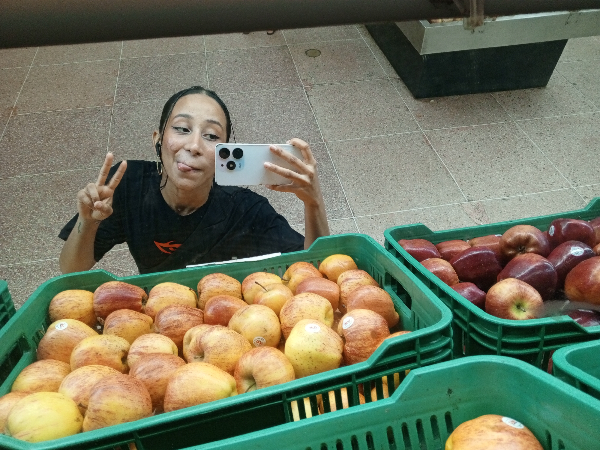 Woman documents shopping trip with selfies in Porlamar supermarket