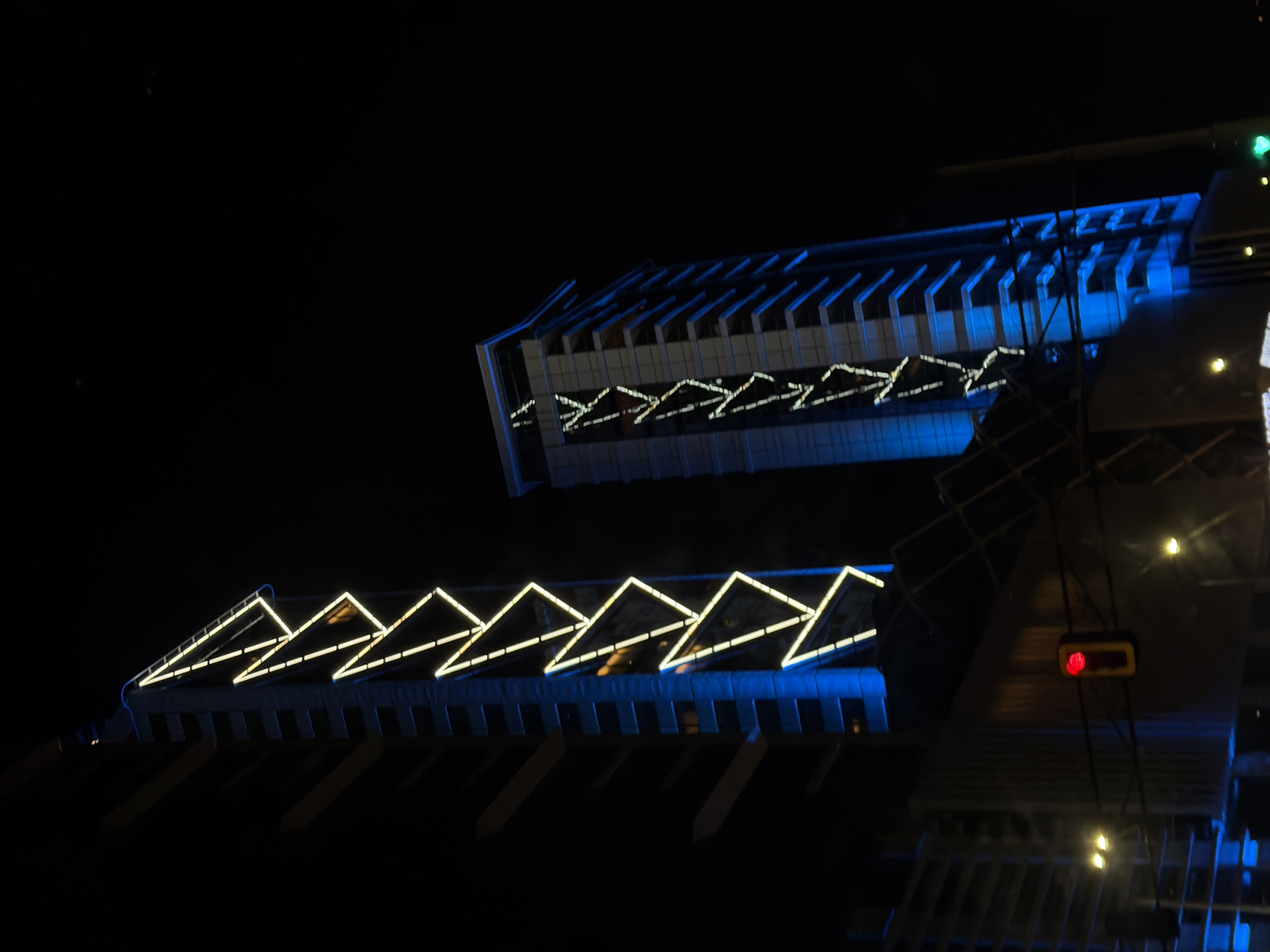 Nighttime drive through illuminated Sofia captured from car interior