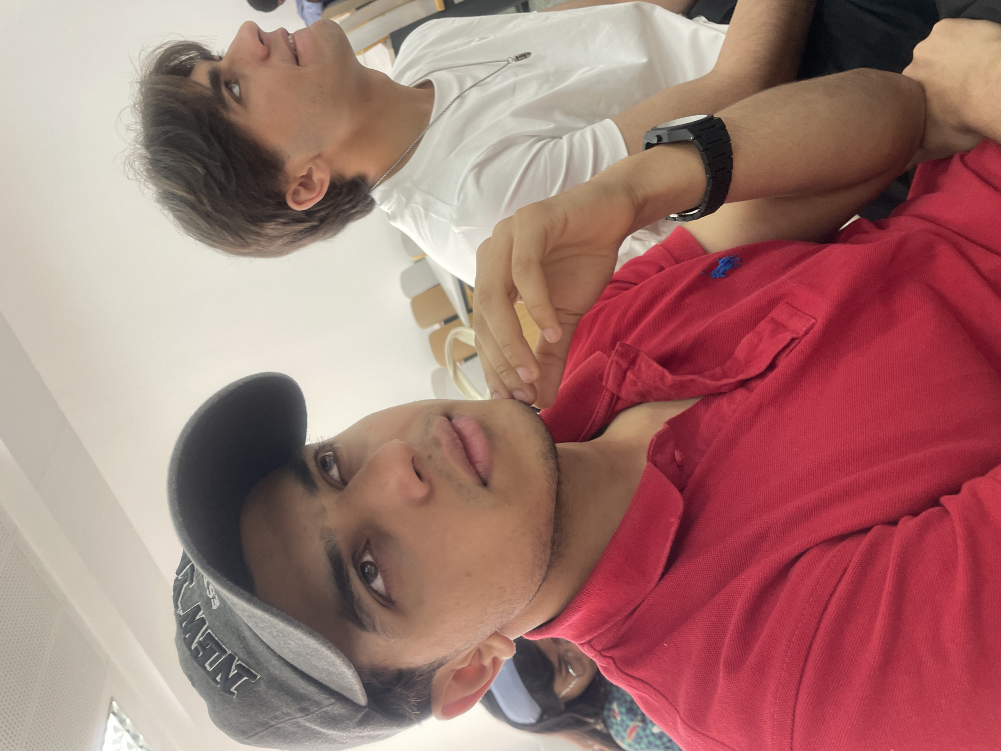 Two young men gather indoors in Beijing suburb