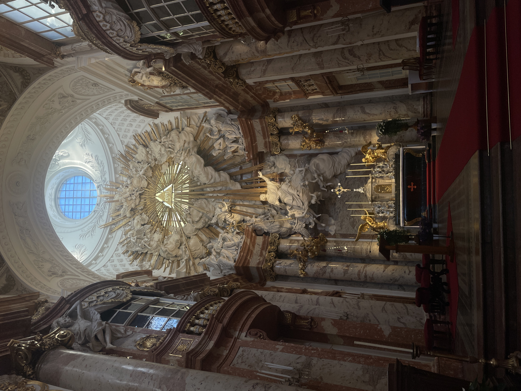 Inside and outside Vienna's Karlskirche on a sunny afternoon