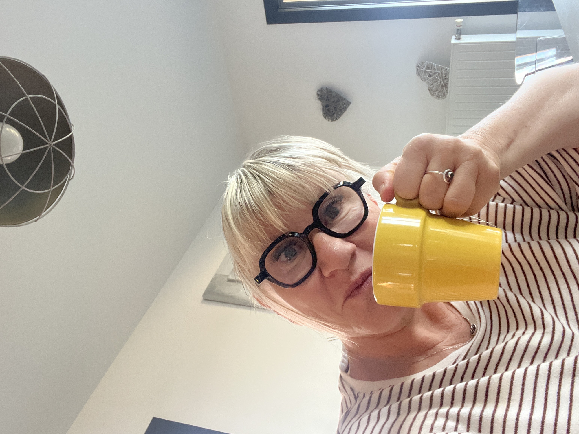 Morning moments captured in Chambœuf: woman with mug, Pomeranian dog