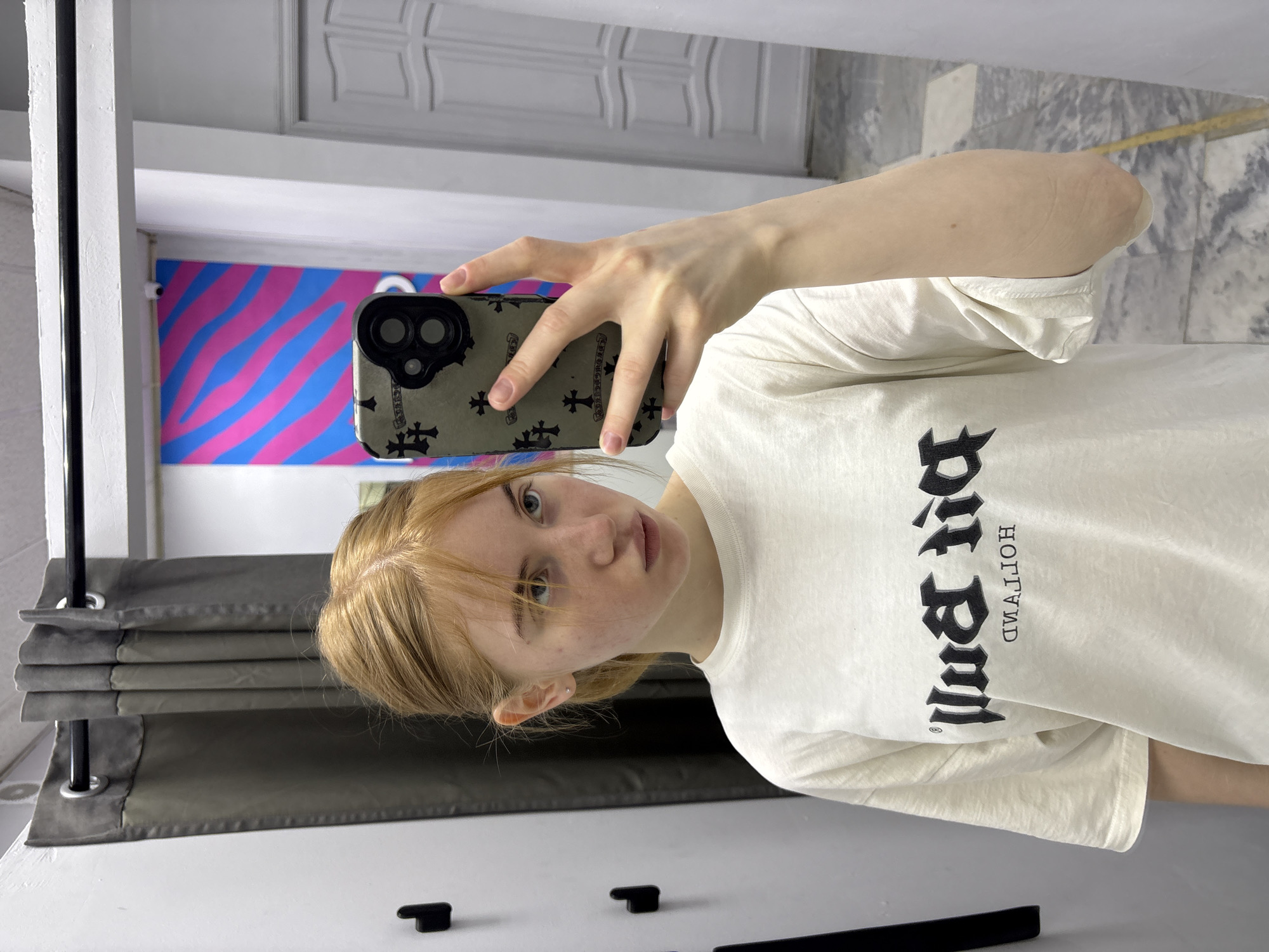 Indoor selfie in Kuznetsk featuring a bold graphic tee
