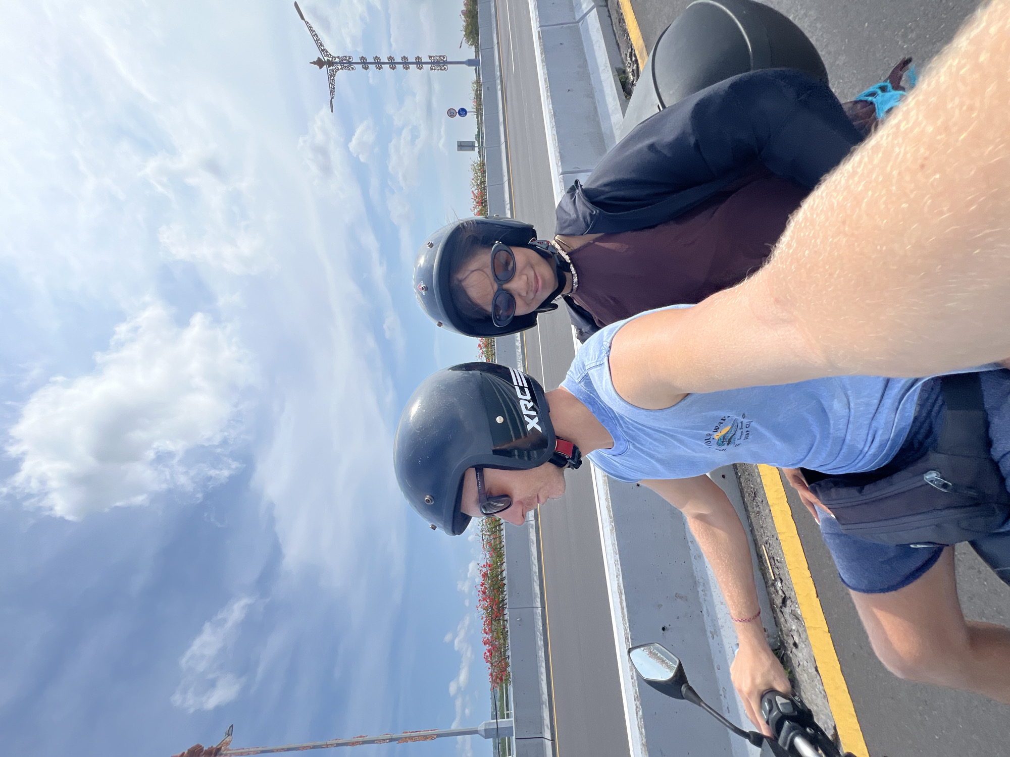 Motorcycle riders cross bridge in Nusa Dua, Indonesia