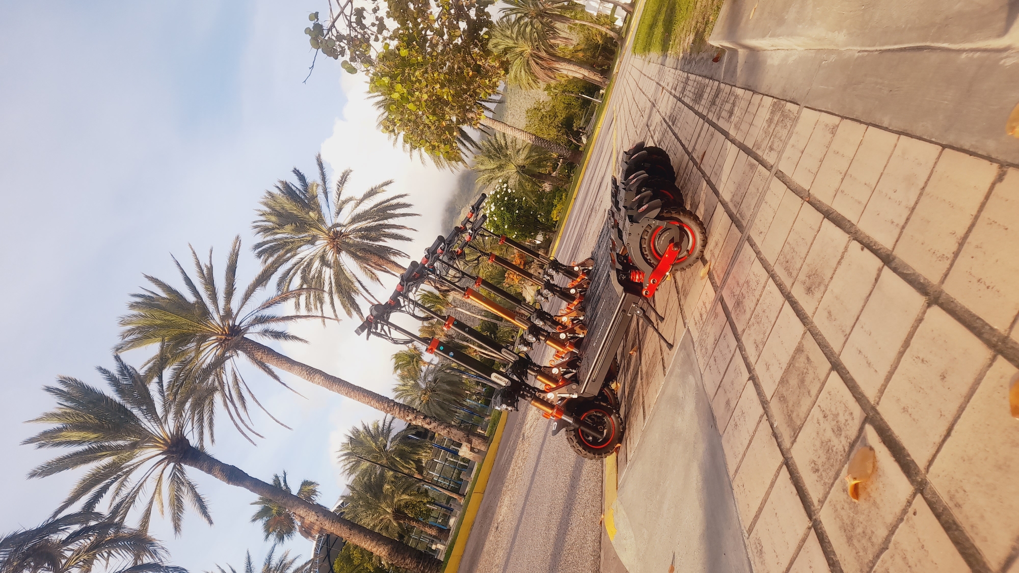 Scooter rental spot at dusk, Pedro González waterfront