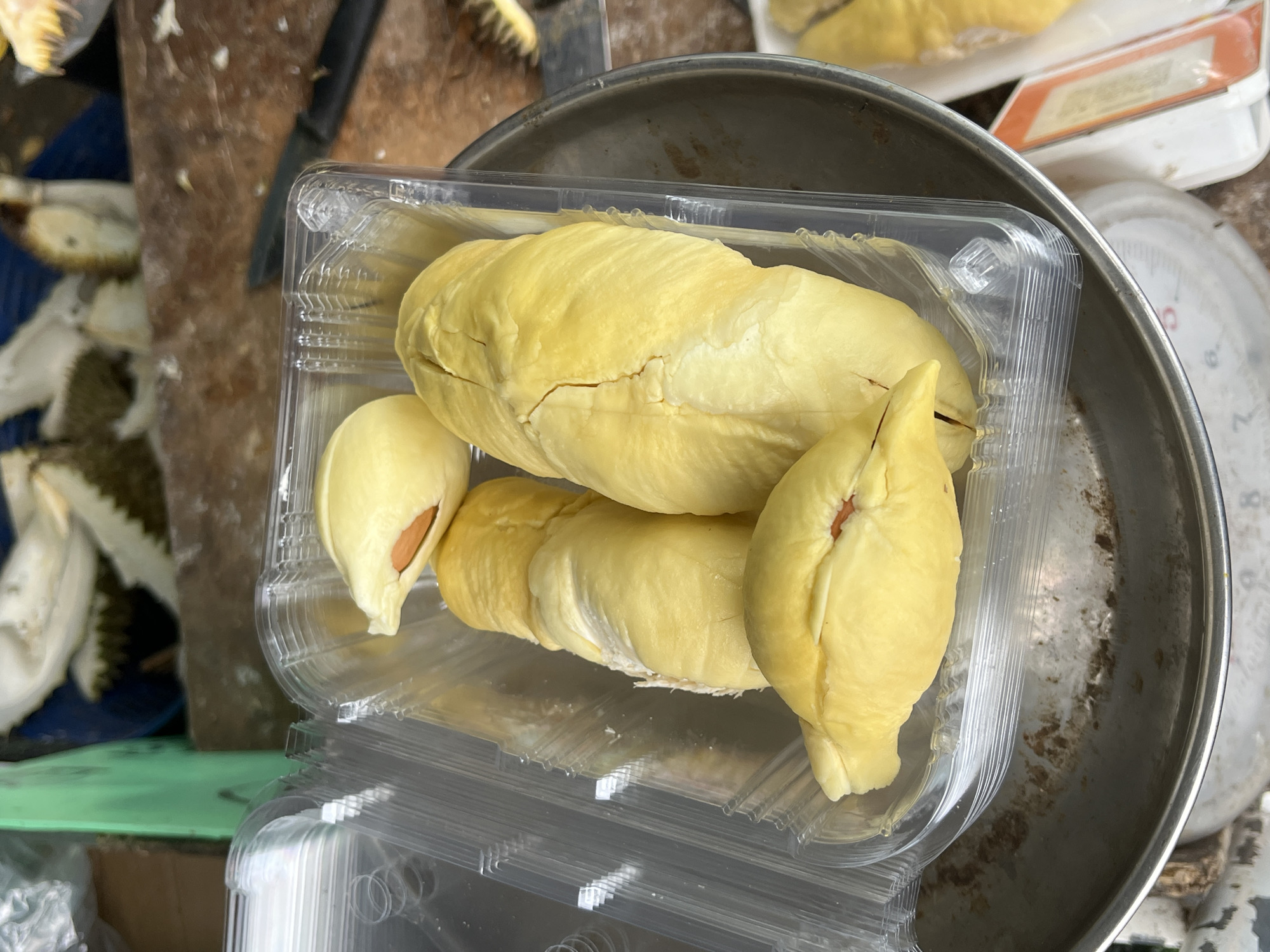 Durian stall in Rawai selling fresh-cut fruit and mangosteens