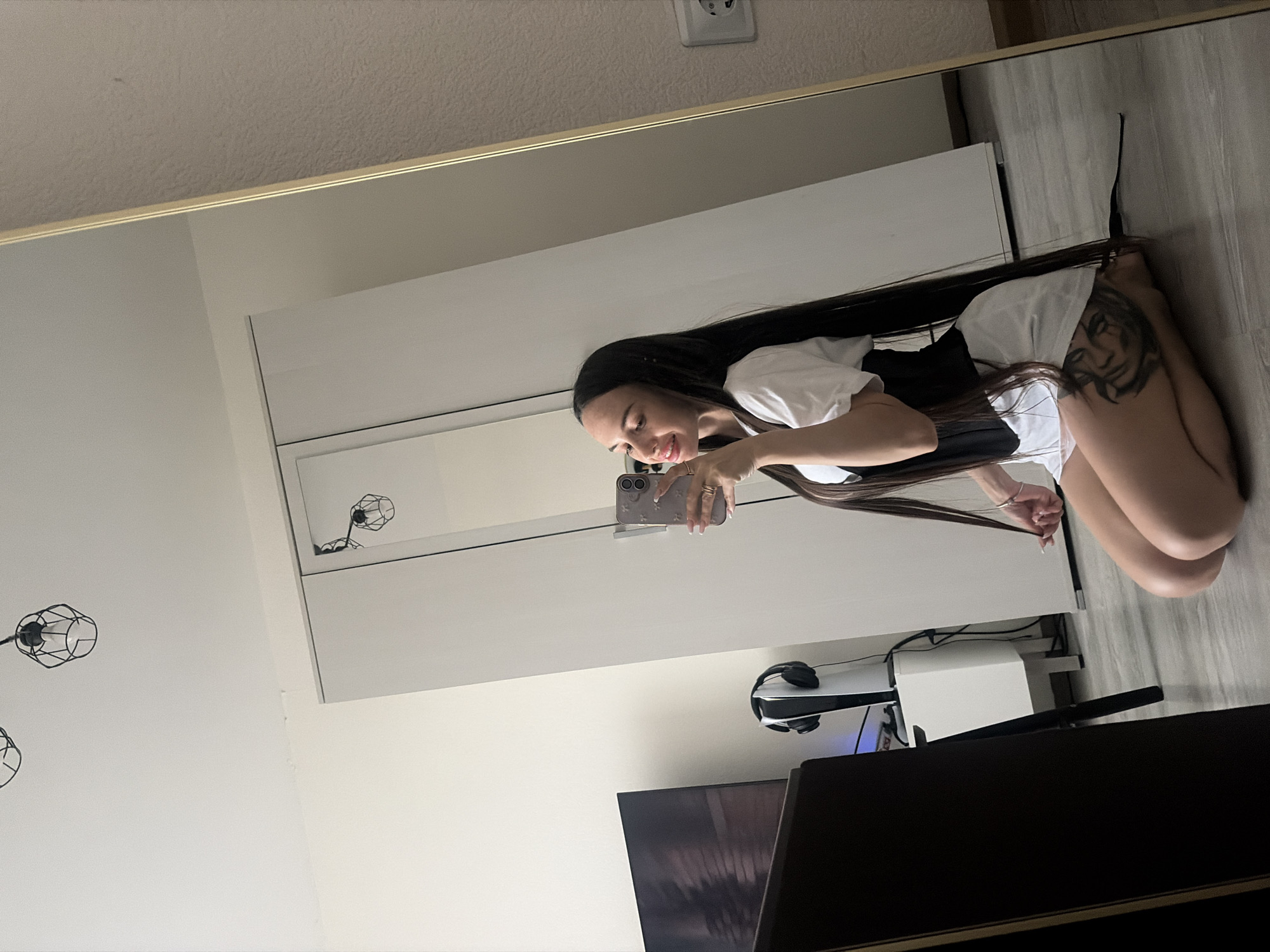 Woman takes mirror selfies in Saint Petersburg bedroom