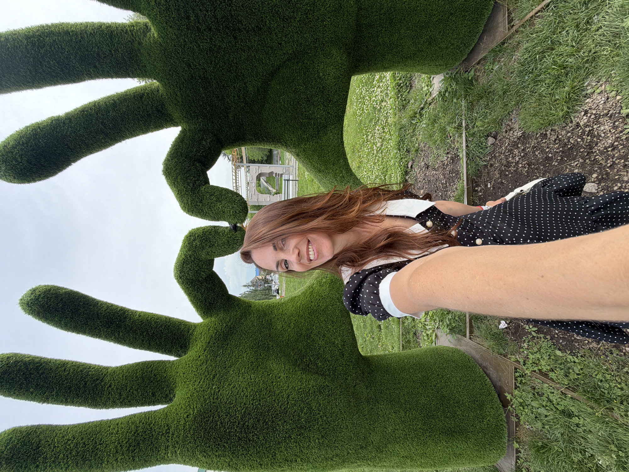 Selfies at Birobidzhan's green topiary heart sculpture