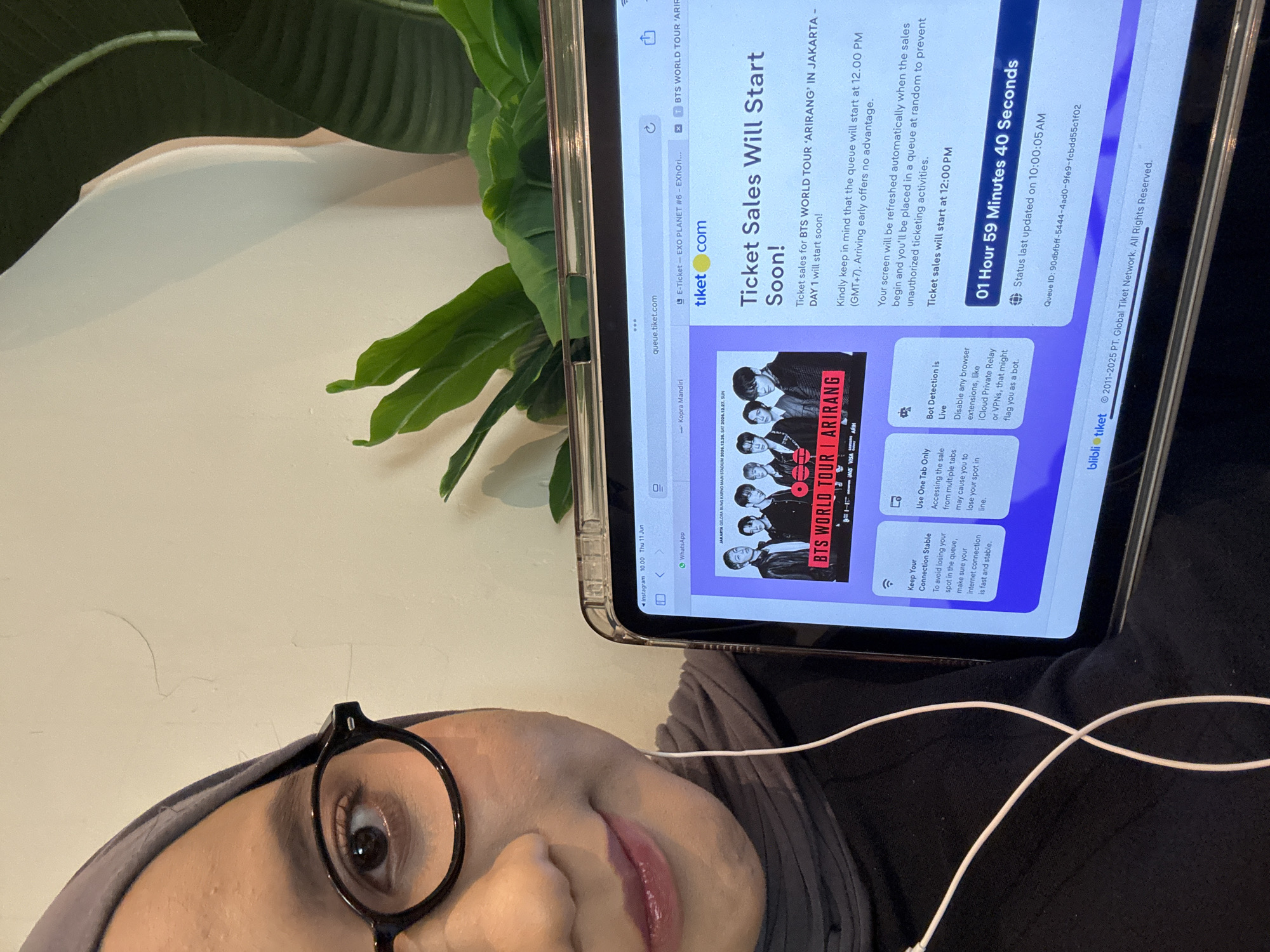 Woman monitors BTS concert ticket sales in West Jakarta