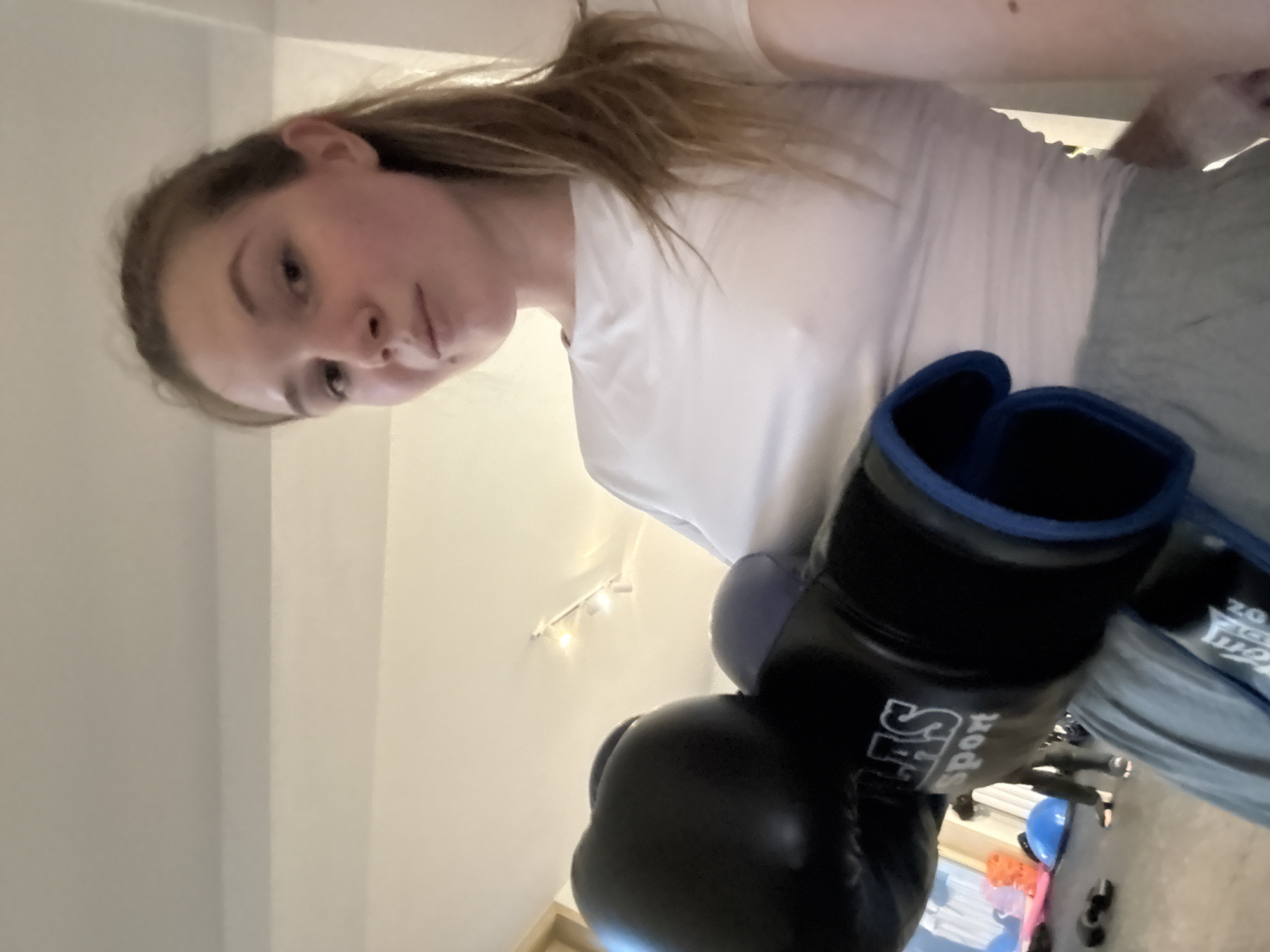 Woman displays boxing gloves in Belgrade